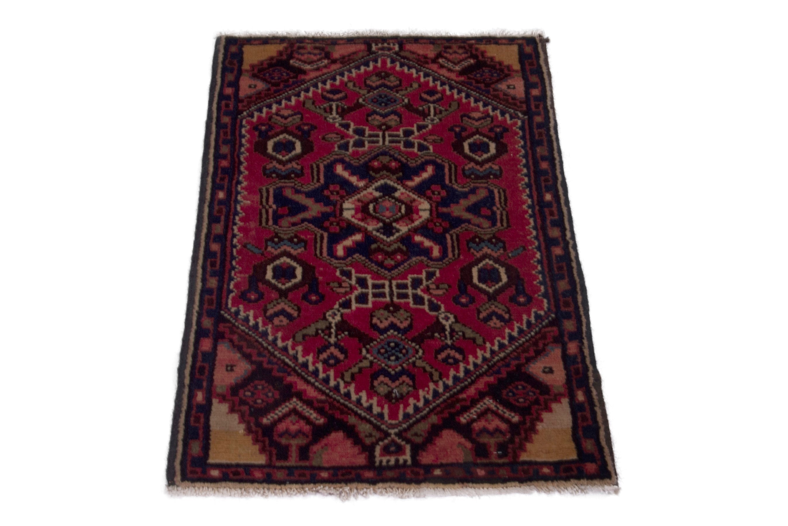 Persian Gharajeh accent rug in deep red and navy, view 2 of 6