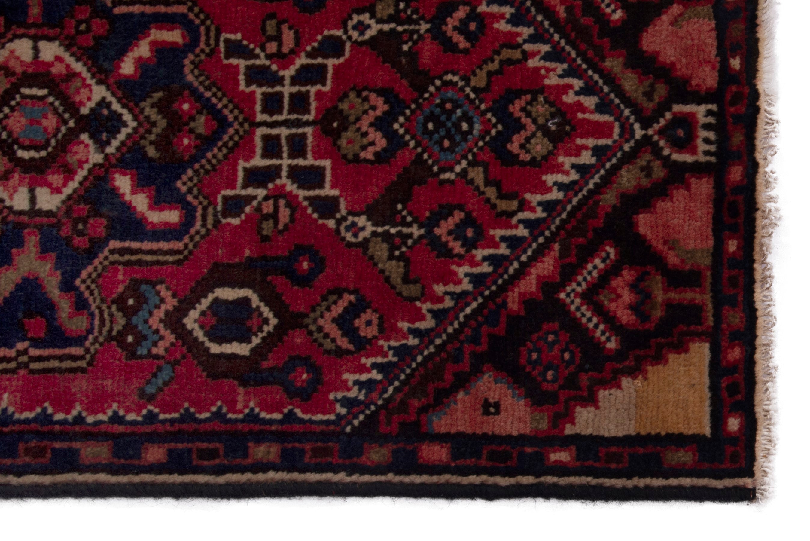 Persian Gharajeh accent rug in deep red and navy, view 4 of 6