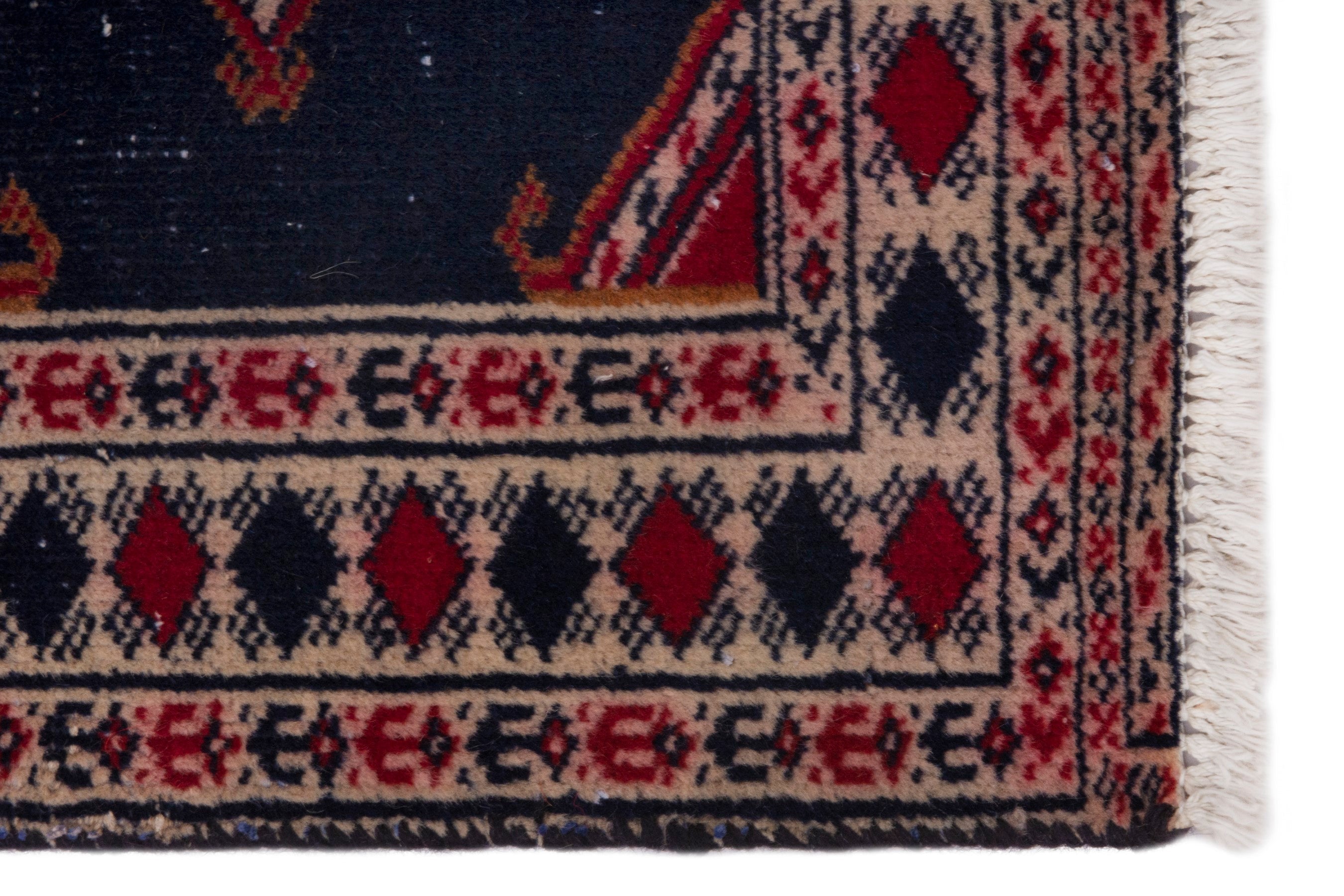 Persian Torkaman accent rug in navy and deep red, view 4 of 7