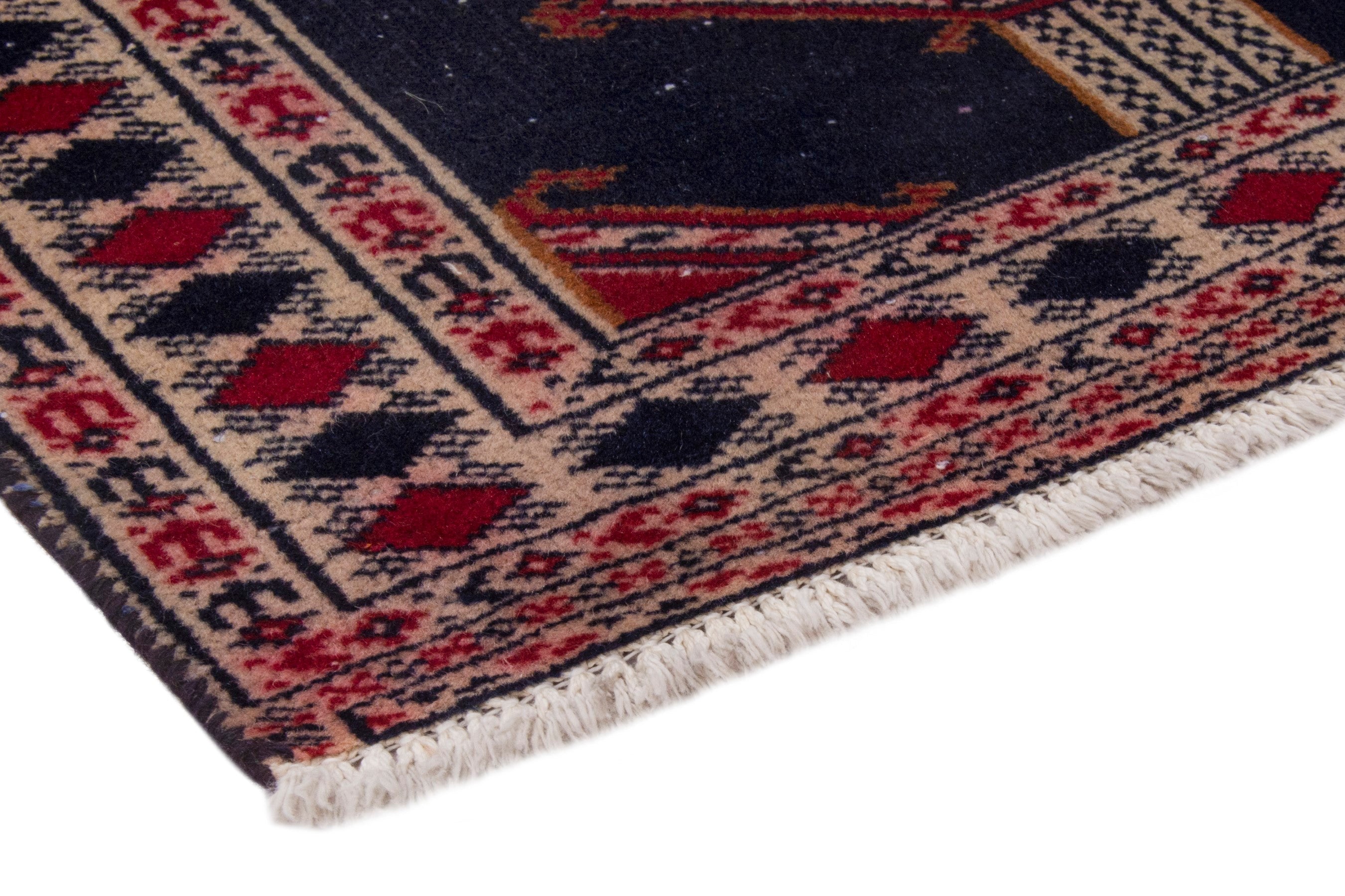 Persian Torkaman accent rug in navy and deep red, view 5 of 7