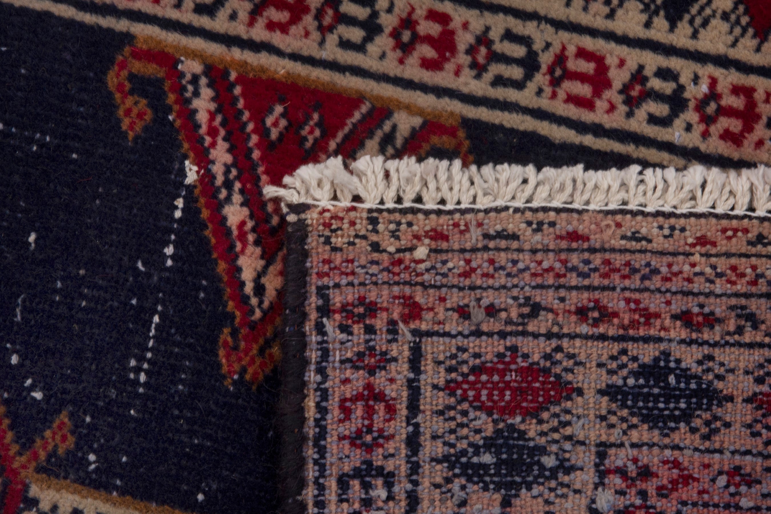 Persian Torkaman accent rug in navy and deep red, view 7 of 7