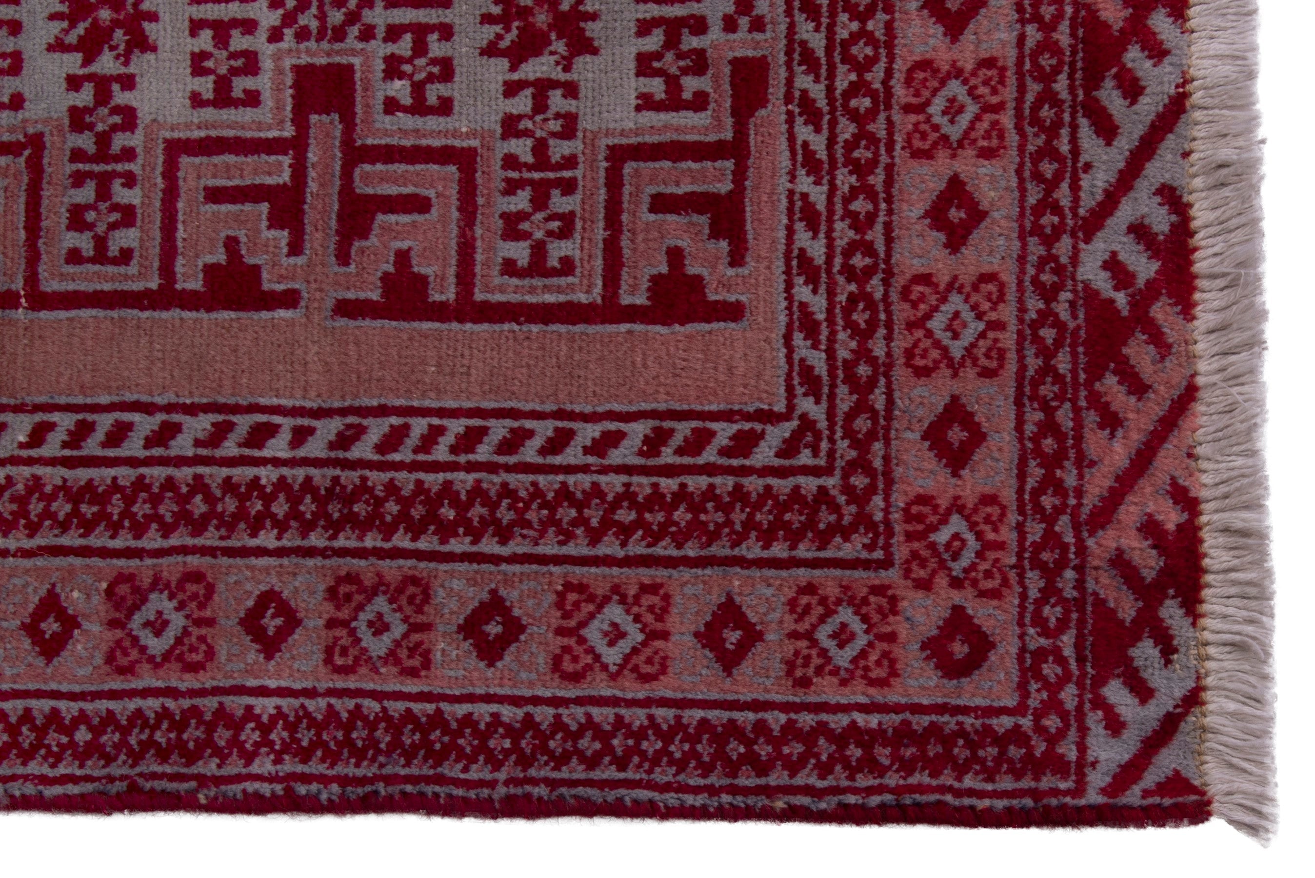Persian Torkaman accent rug in burgundy and rose, view 4 of 7