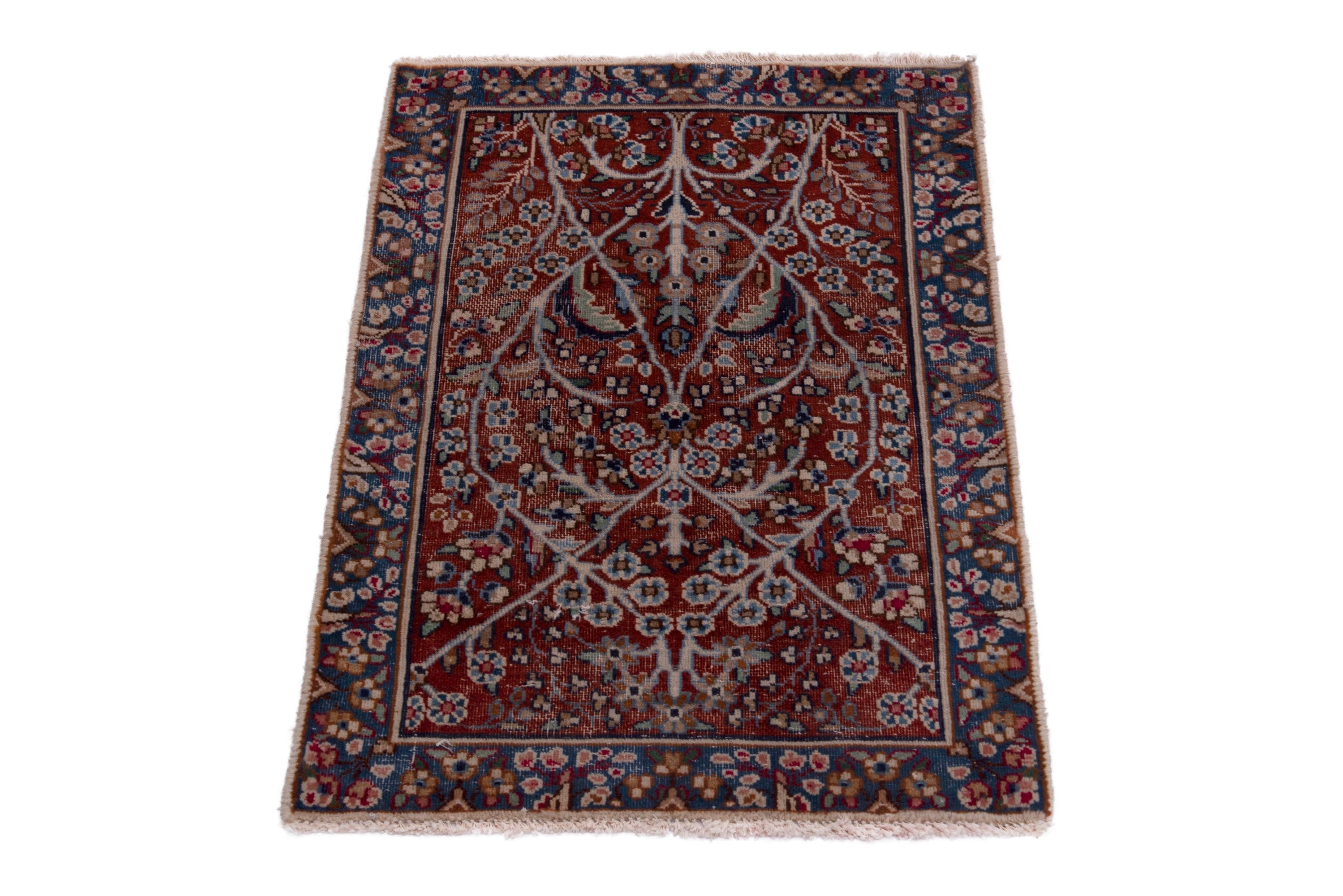 Persian Kerman accent rug in deep red and navy, view 2 of 7
