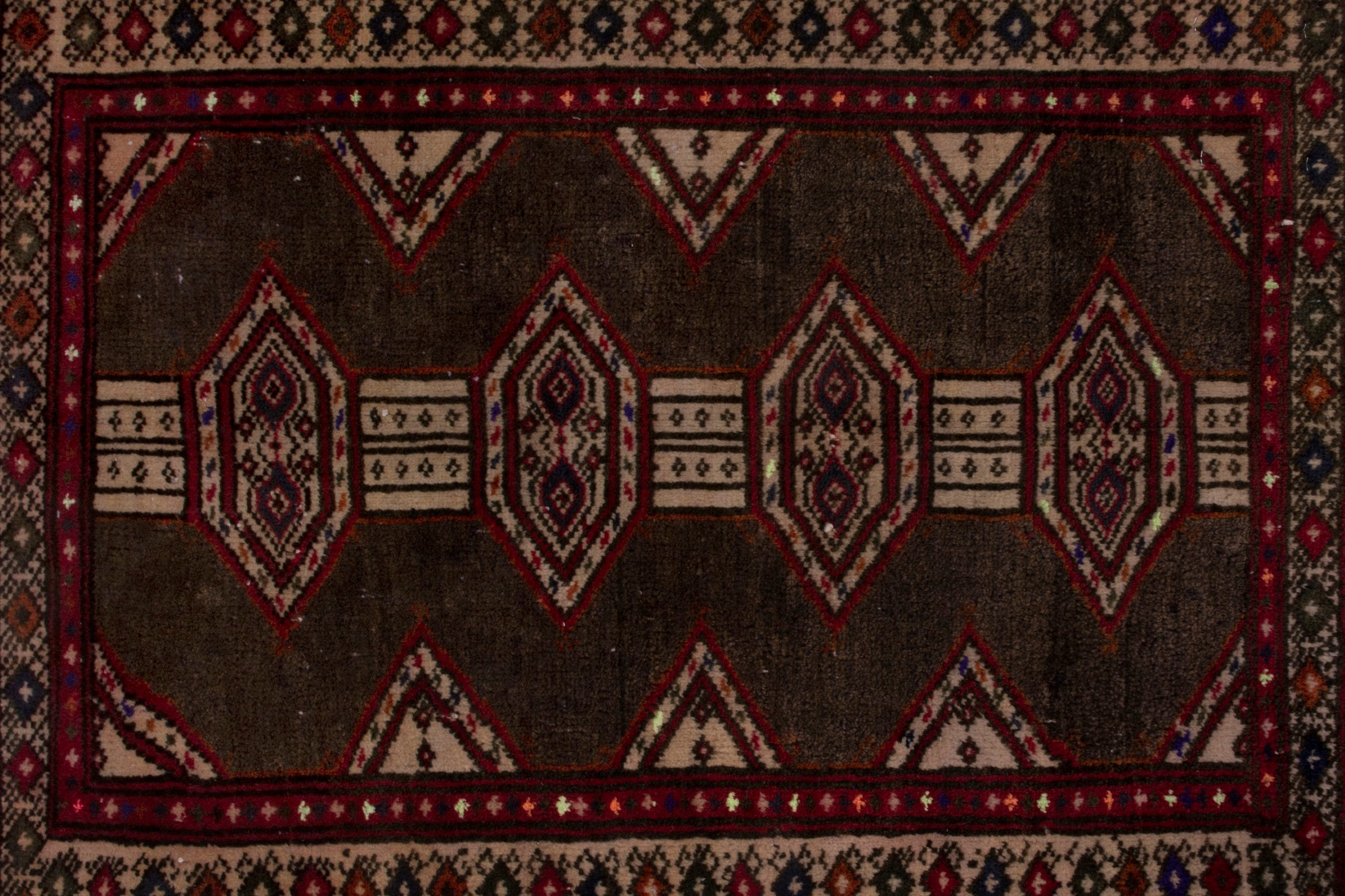 Persian Torkaman accent rug in dark brown and burgundy, view 6 of 7