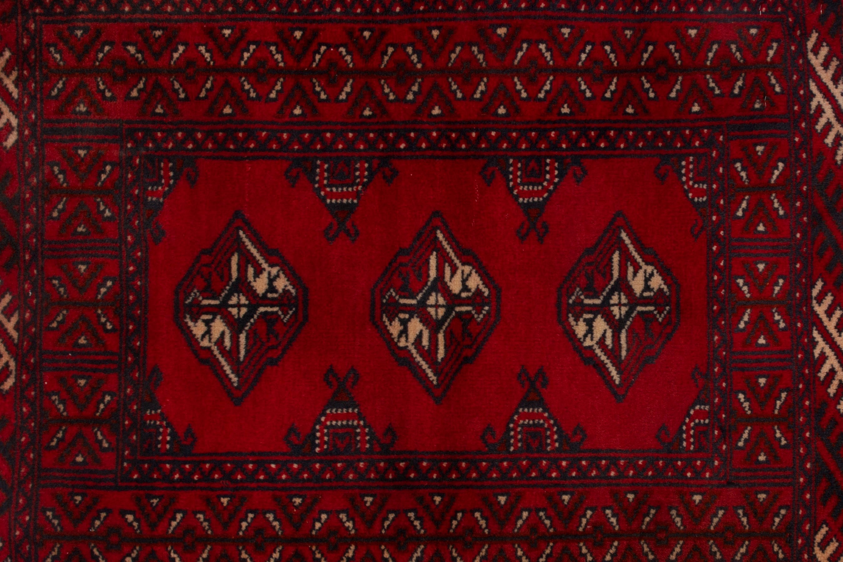 Persian Torkaman accent rug in deep red and burgundy, view 6 of 7