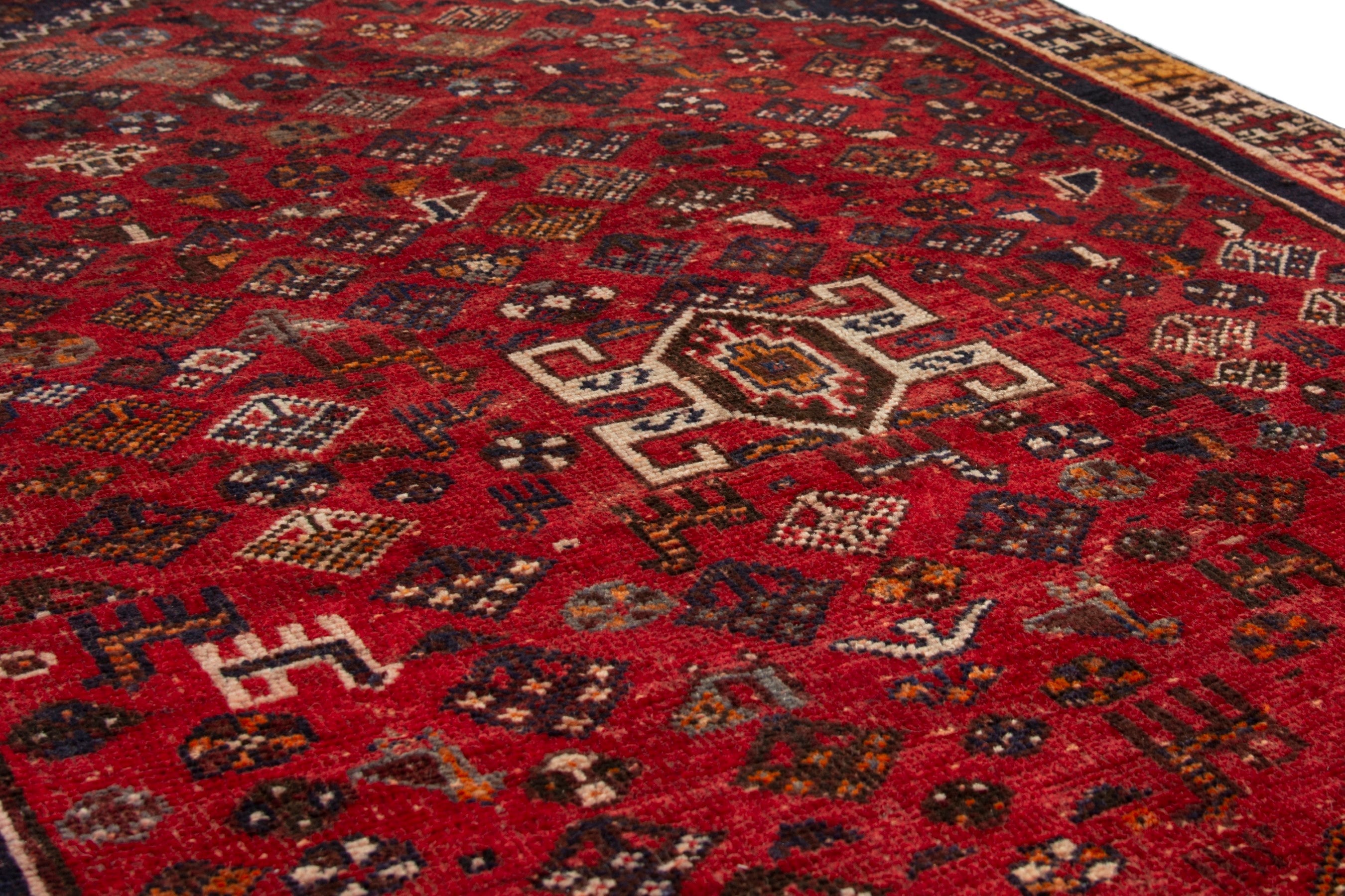 Persian Shiraz accent rug in deep red and navy, view 7 of 18
