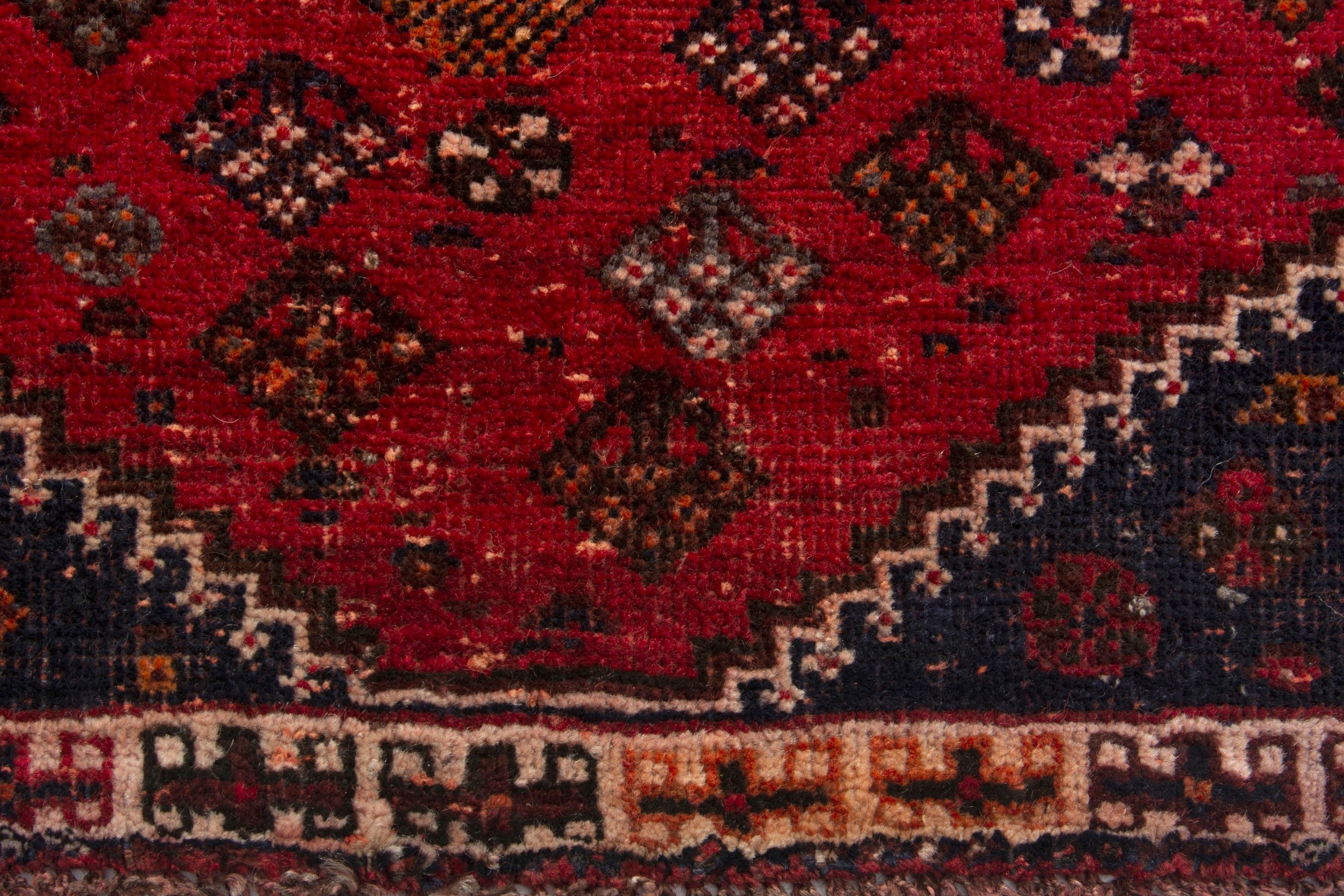 Persian Shiraz accent rug in deep red and navy, view 11 of 18