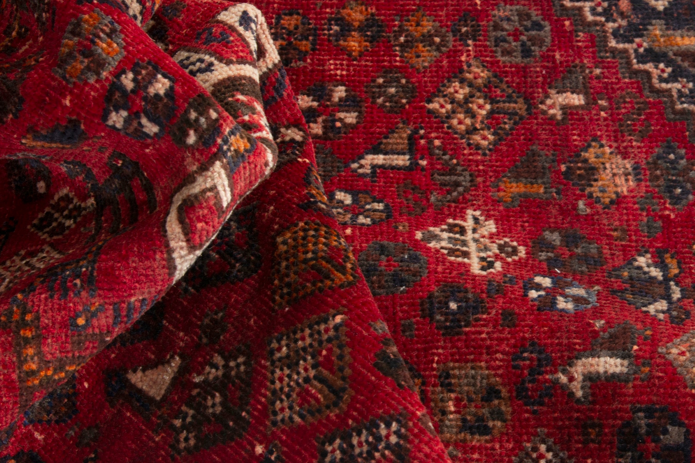 Persian Shiraz accent rug in deep red and navy, view 15 of 18
