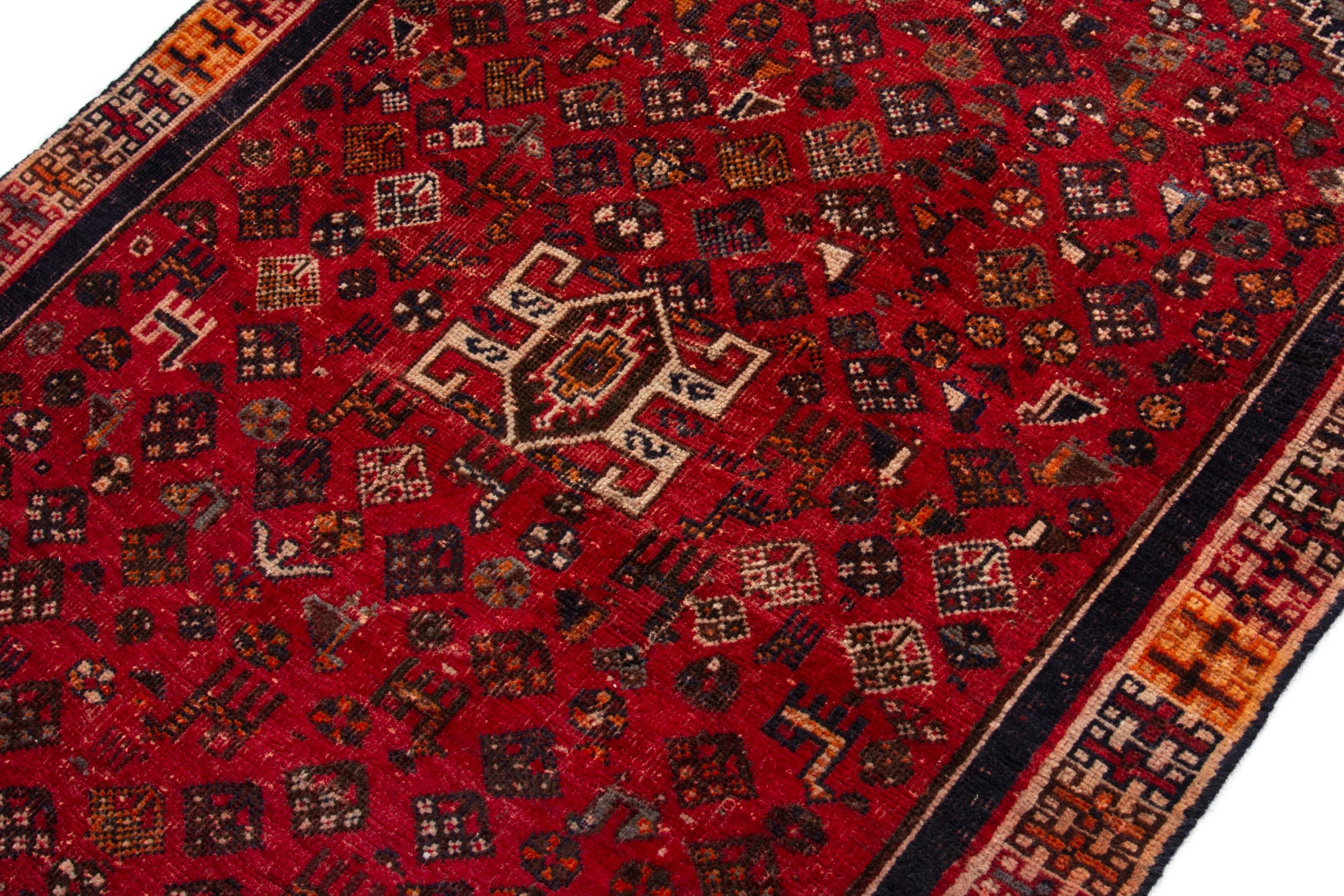 Persian Shiraz accent rug in deep red and navy, view 6 of 18