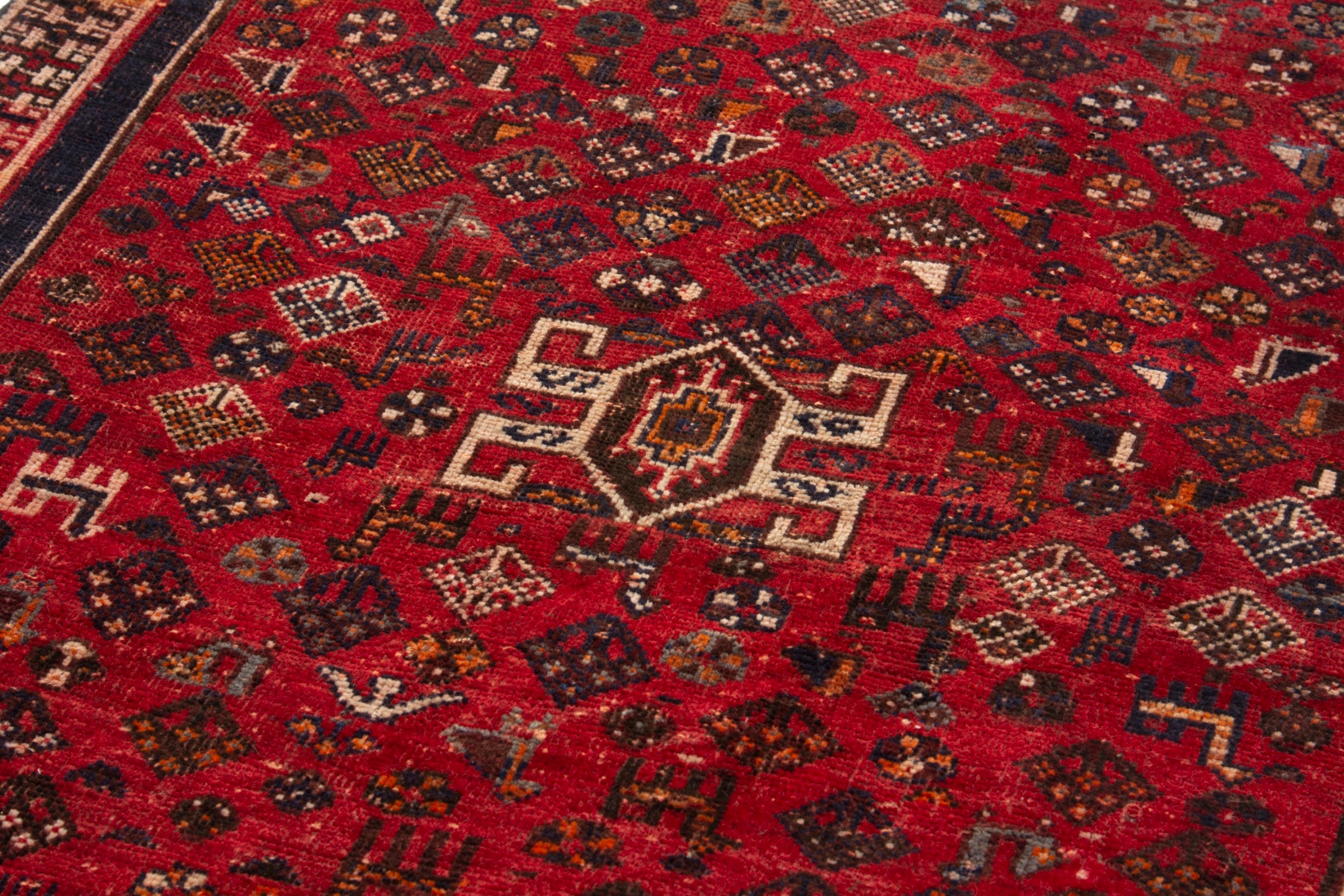 Persian Shiraz accent rug in deep red and navy, view 8 of 18