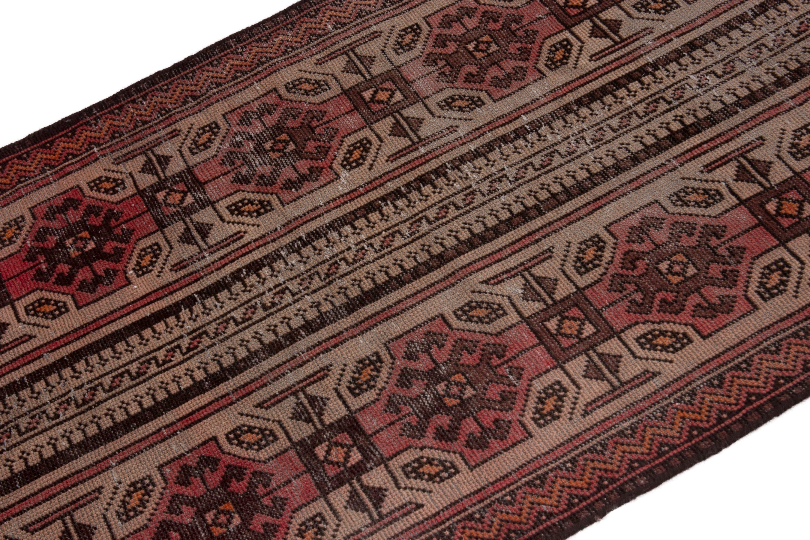 Persian Baluch accent rug in deep red and cream, view 6 of 18
