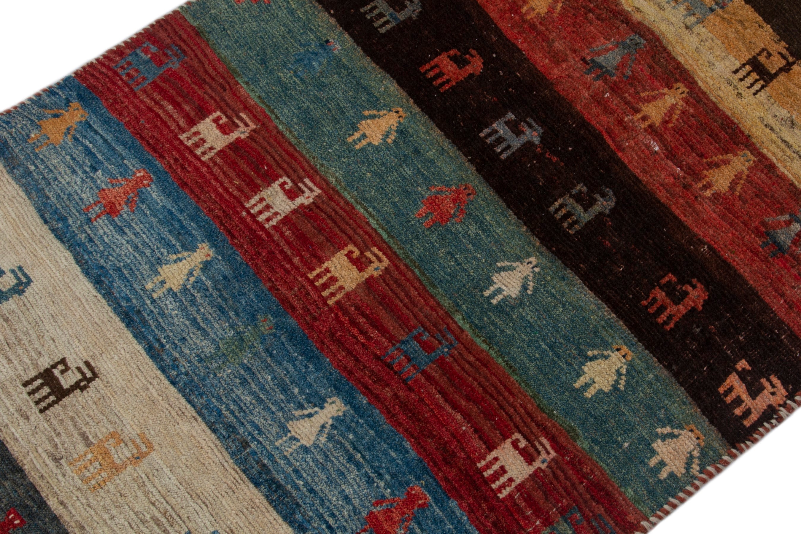 Persian Gabbeh accent rug in deep red and dark blue, view 6 of 16