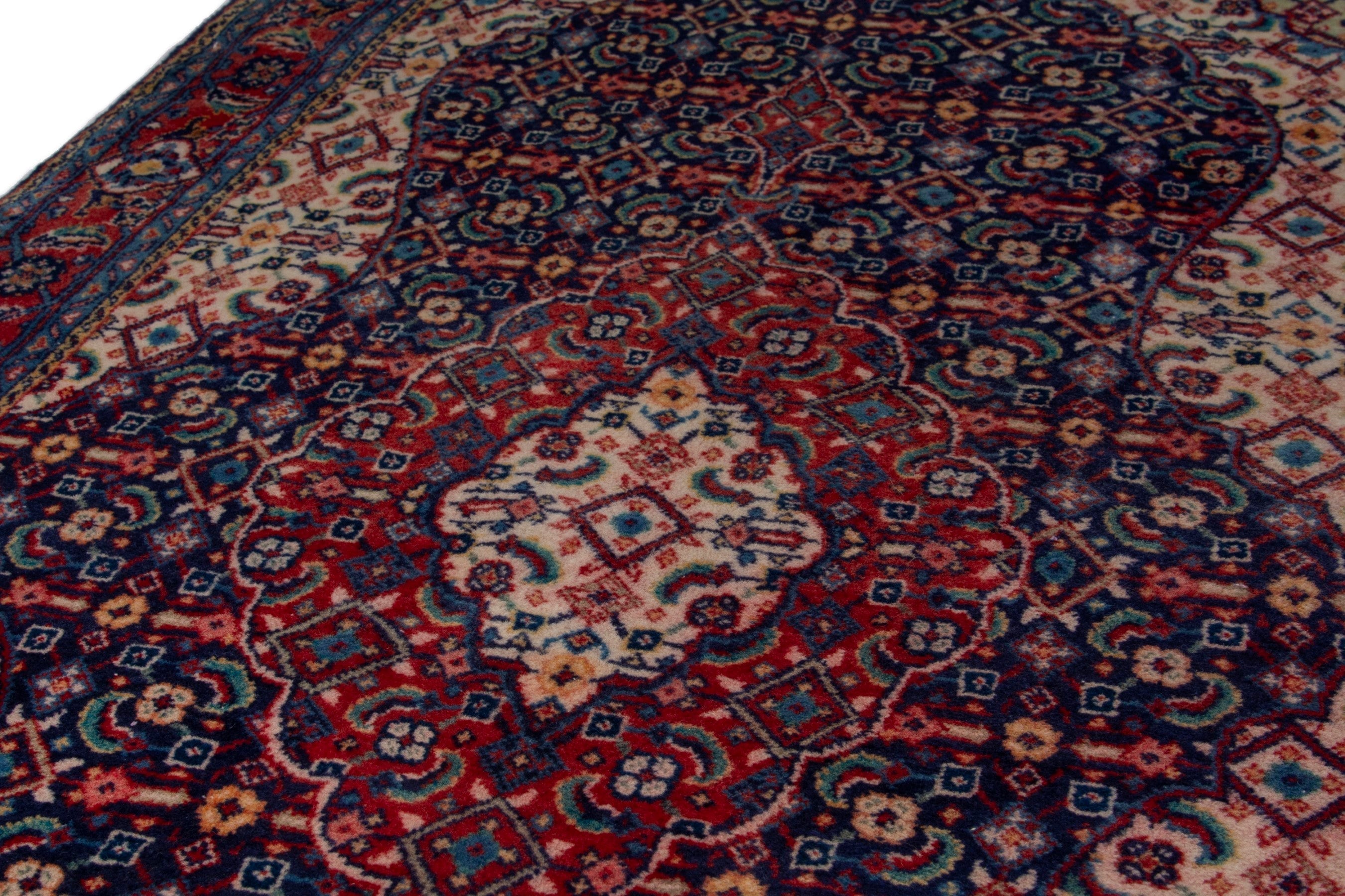 Persian Mahal area rug in navy and deep red, view 8 of 17