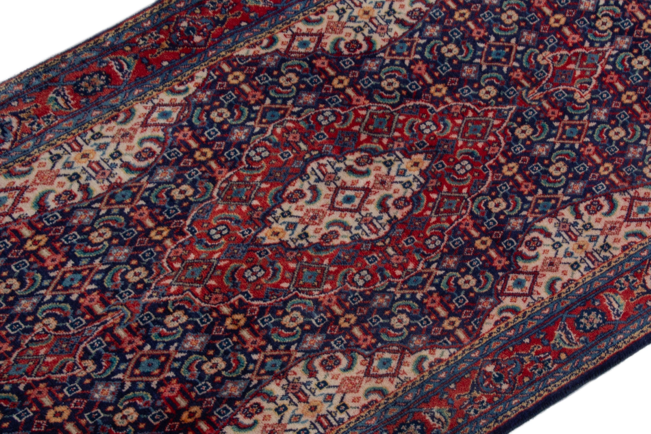 Persian Mahal area rug in navy and deep red, view 6 of 17