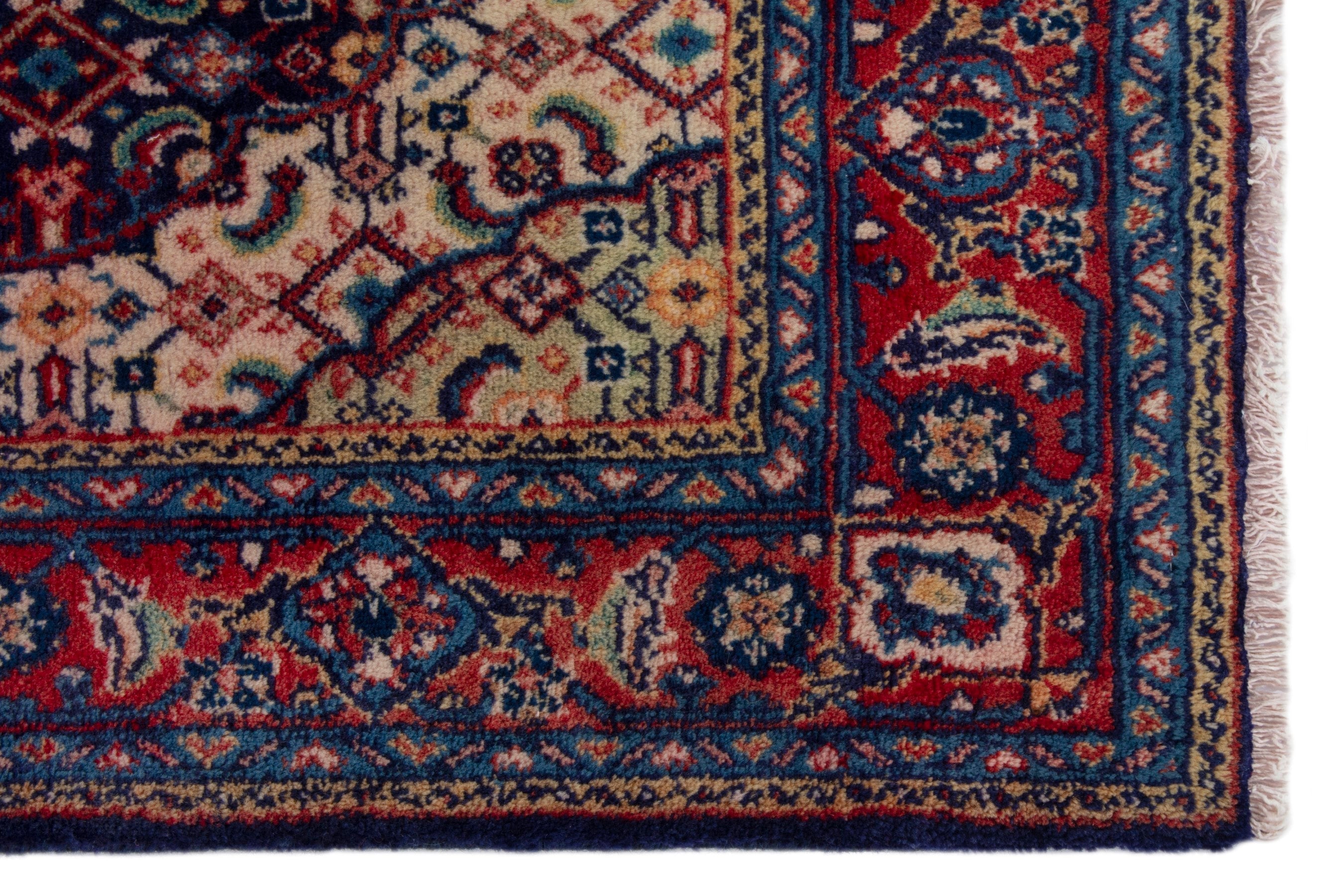 Persian Mahal area rug in navy and deep red, view 10 of 17