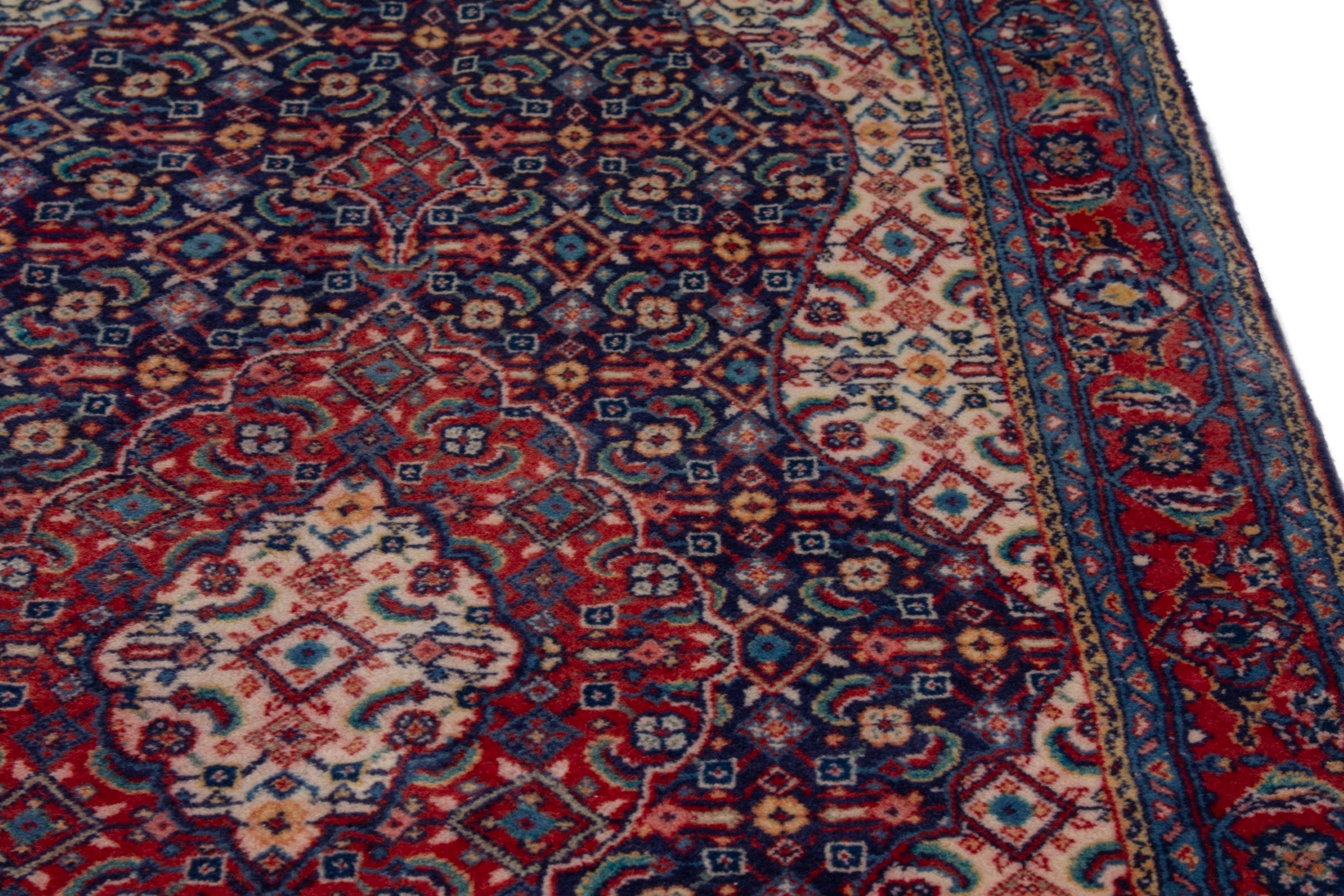 Persian Mahal area rug in navy and deep red, view 9 of 17
