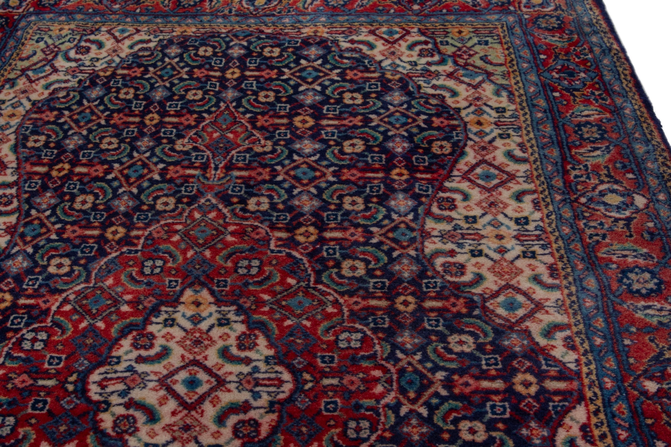 Persian Mahal area rug in navy and deep red, view 7 of 17