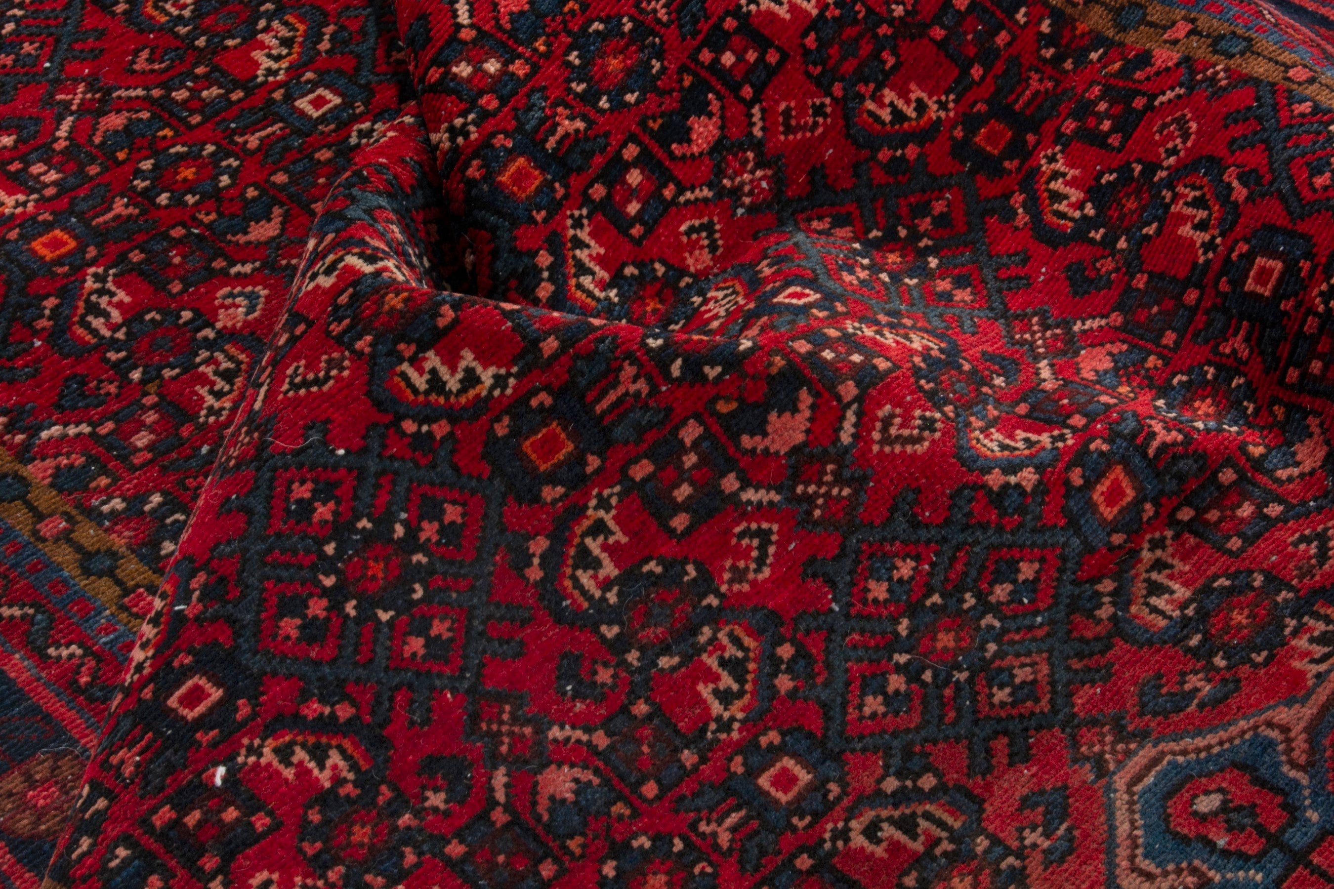 Persian Hosseinabad area rug in burgundy and dark blue, view 17 of 18