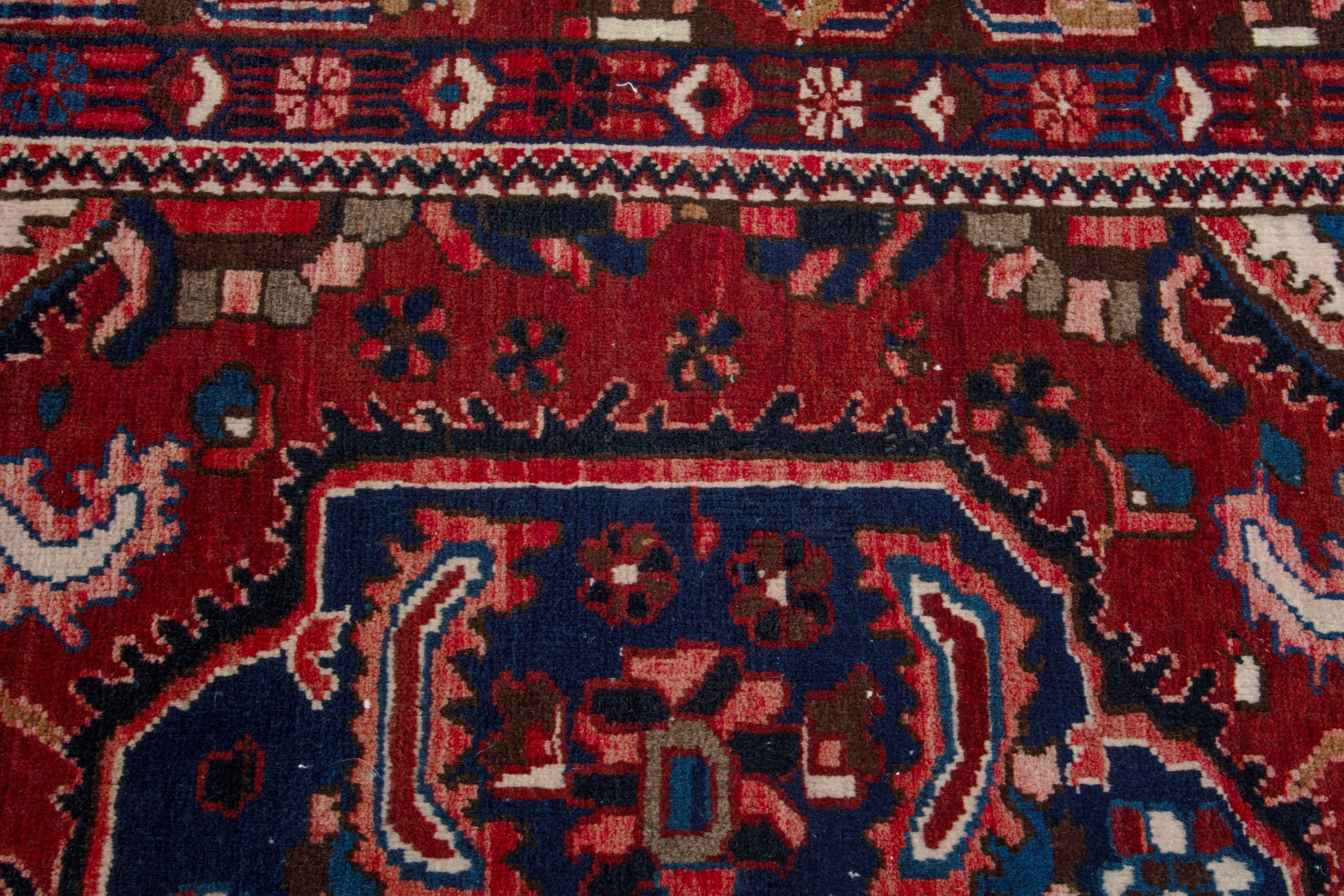 Persian Bakhtiari area rug in deep red and burgundy, view 13 of 19
