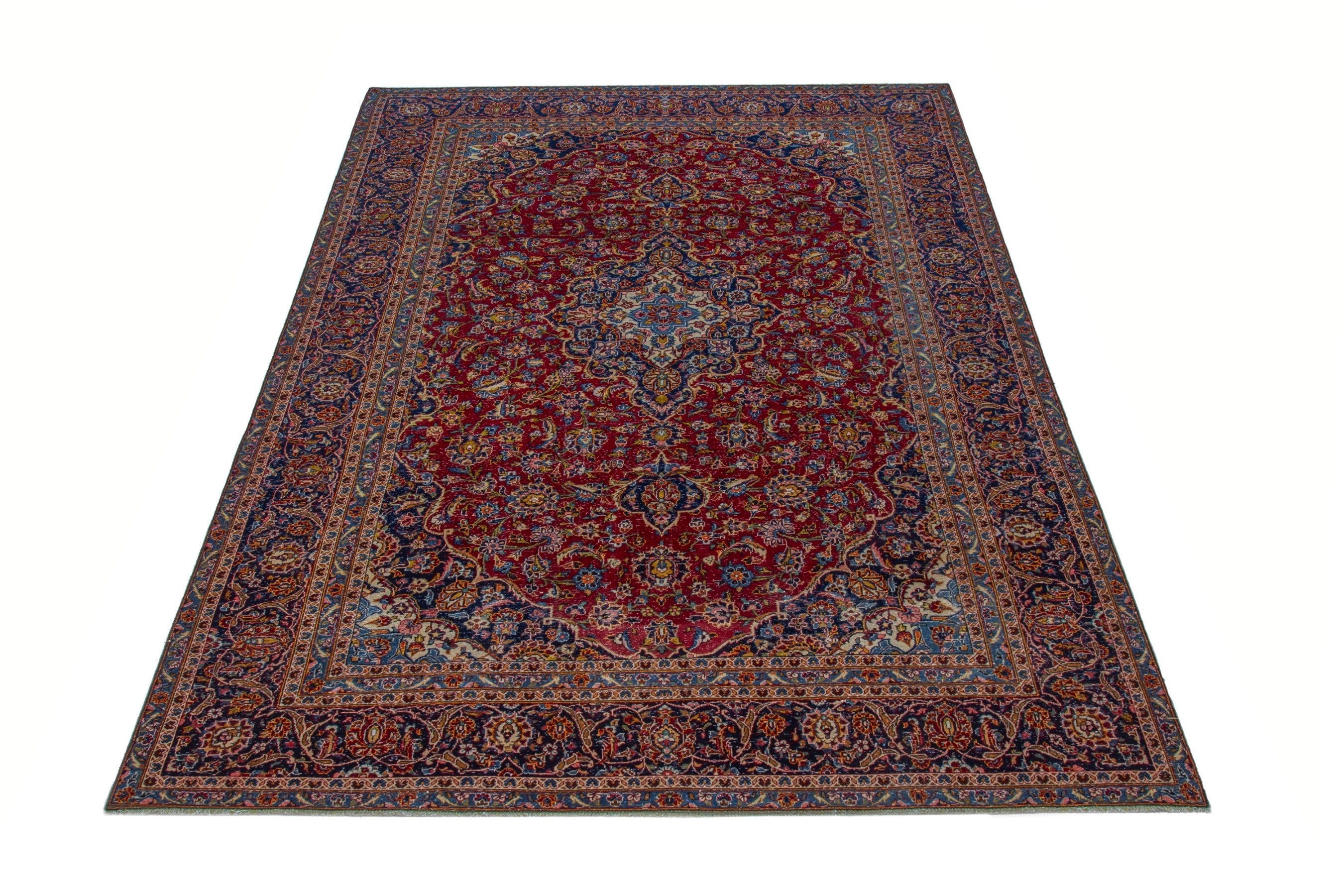 Persian Kashan oversized rug in deep red and dark blue, view 2 of 21
