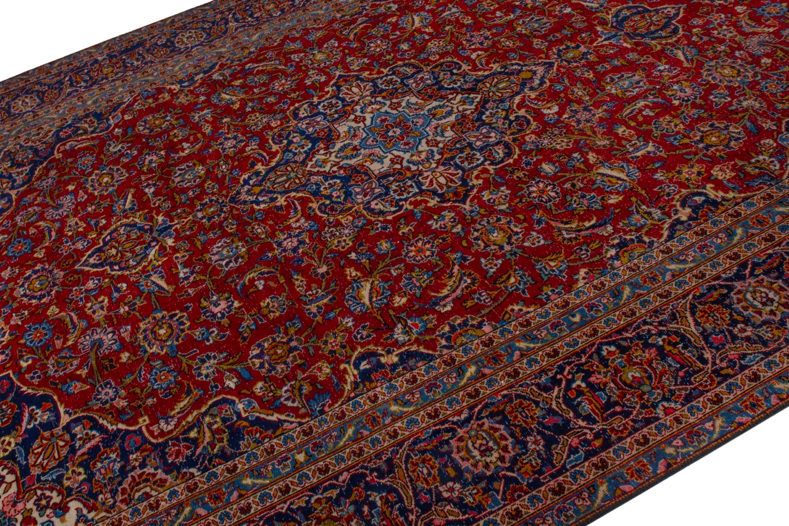 Persian Kashan oversized rug in deep red and dark blue, view 4 of 21