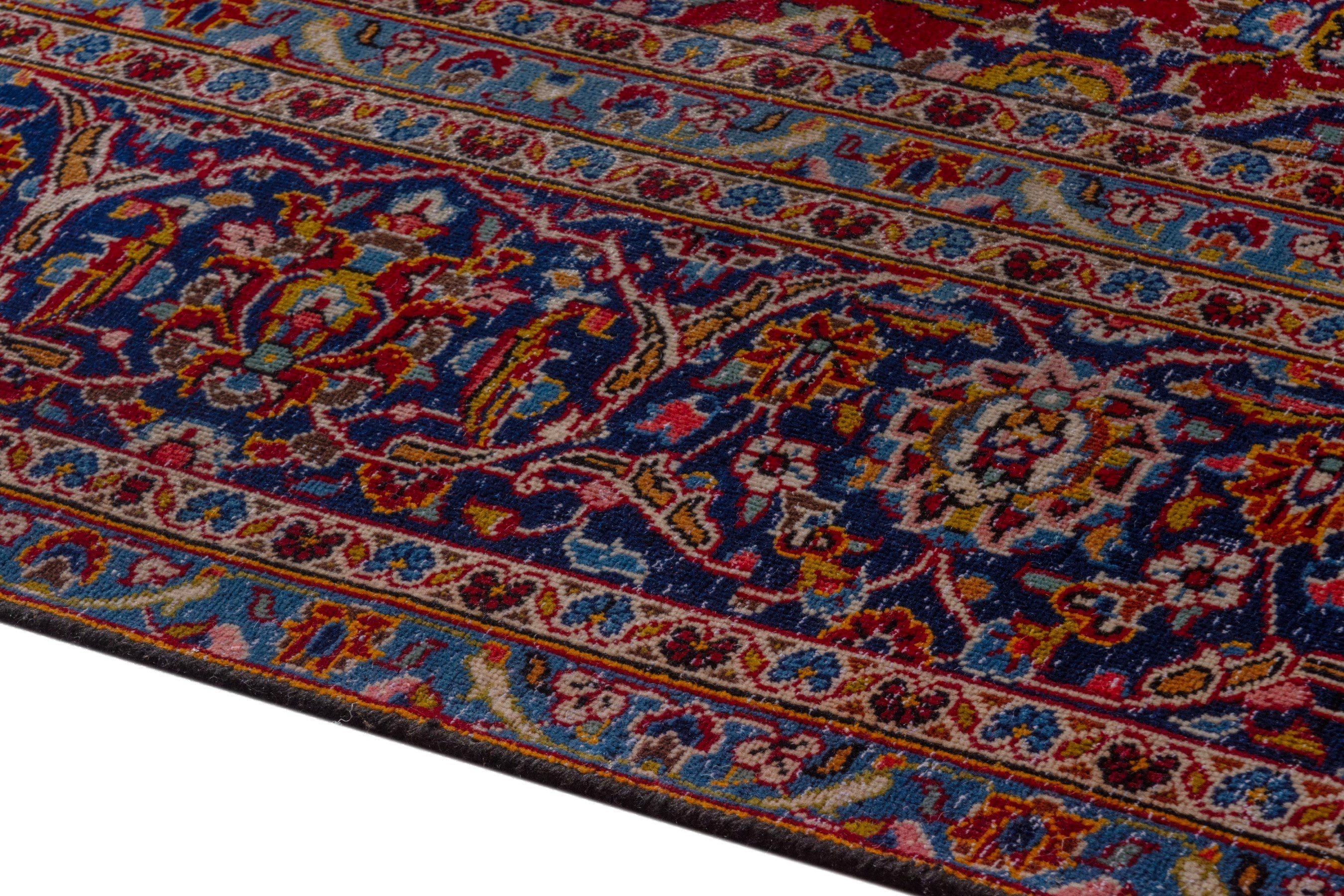 Persian Kashan oversized rug in deep red and dark blue, view 7 of 21