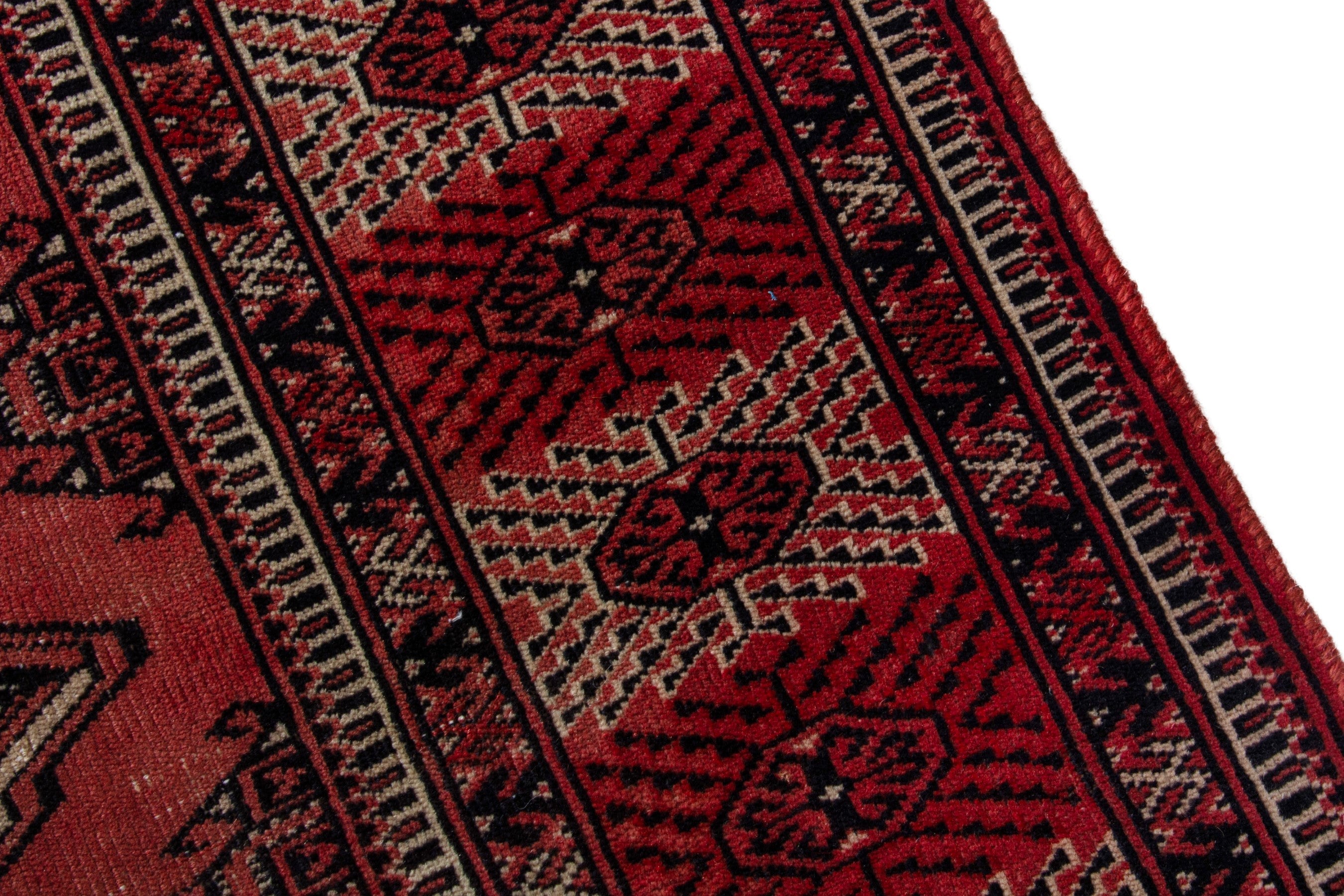 Persian Torkaman area rug in deep red and burgundy, view 6 of 18