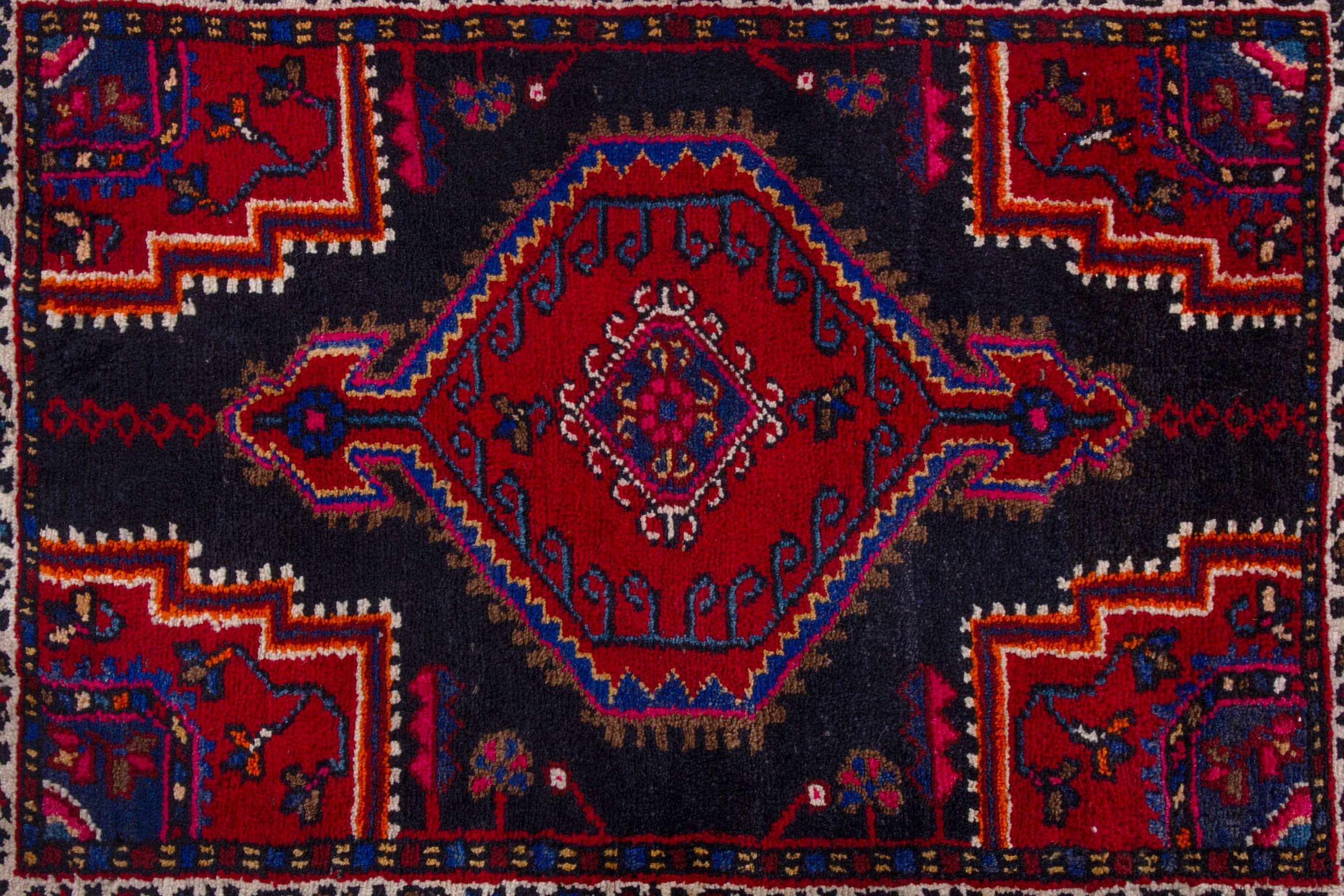 Persian Toyserkan accent rug in navy and deep red, view 6 of 7