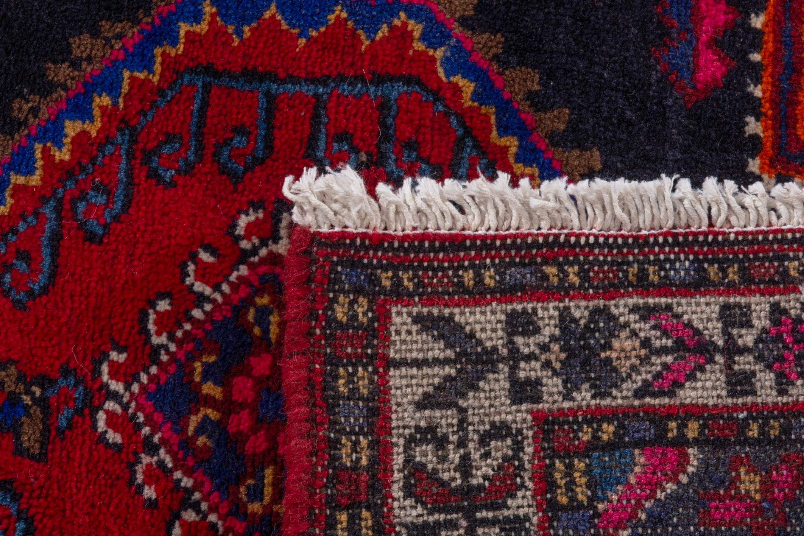 Persian Toyserkan accent rug in navy and deep red, view 7 of 7