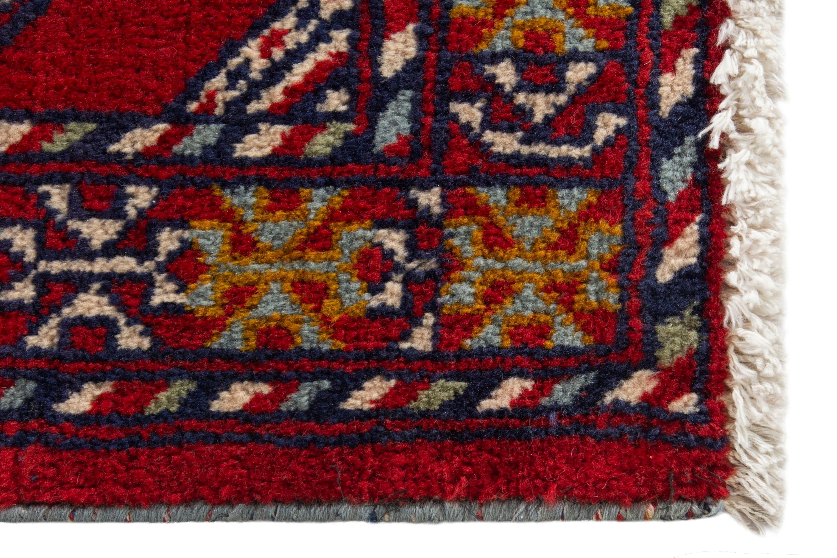 Persian Torkaman accent rug in deep red and burgundy, view 5 of 9
