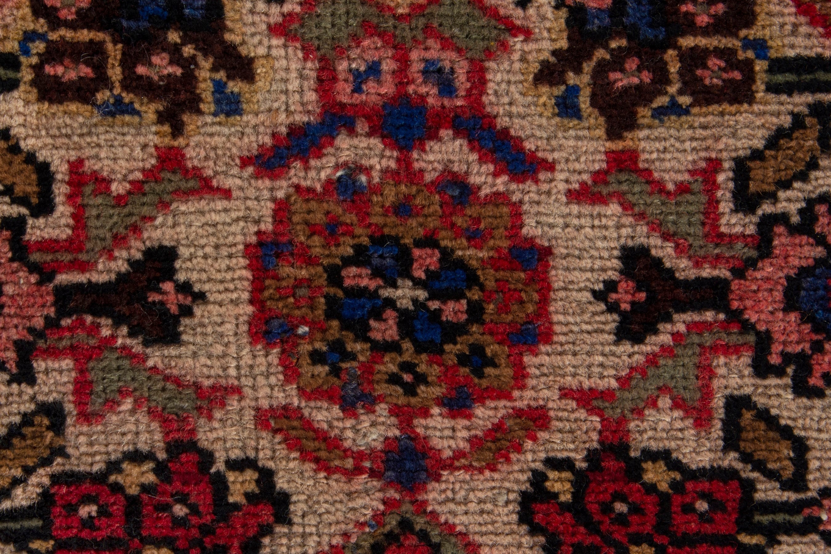 Persian Gharajeh accent rug in muted pink and deep red, view 8 of 9