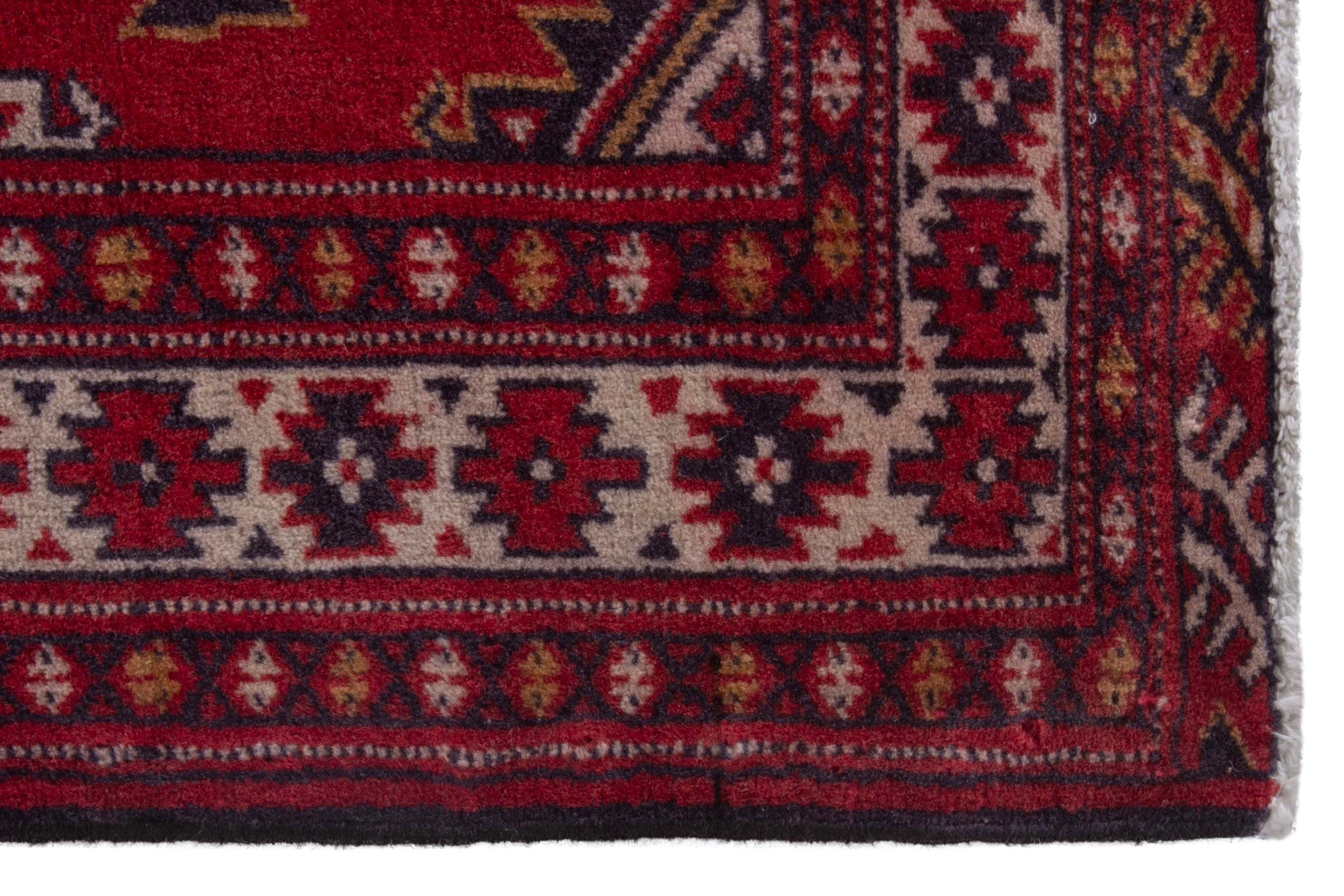 Persian Torkaman accent rug in deep red and burgundy, view 5 of 7