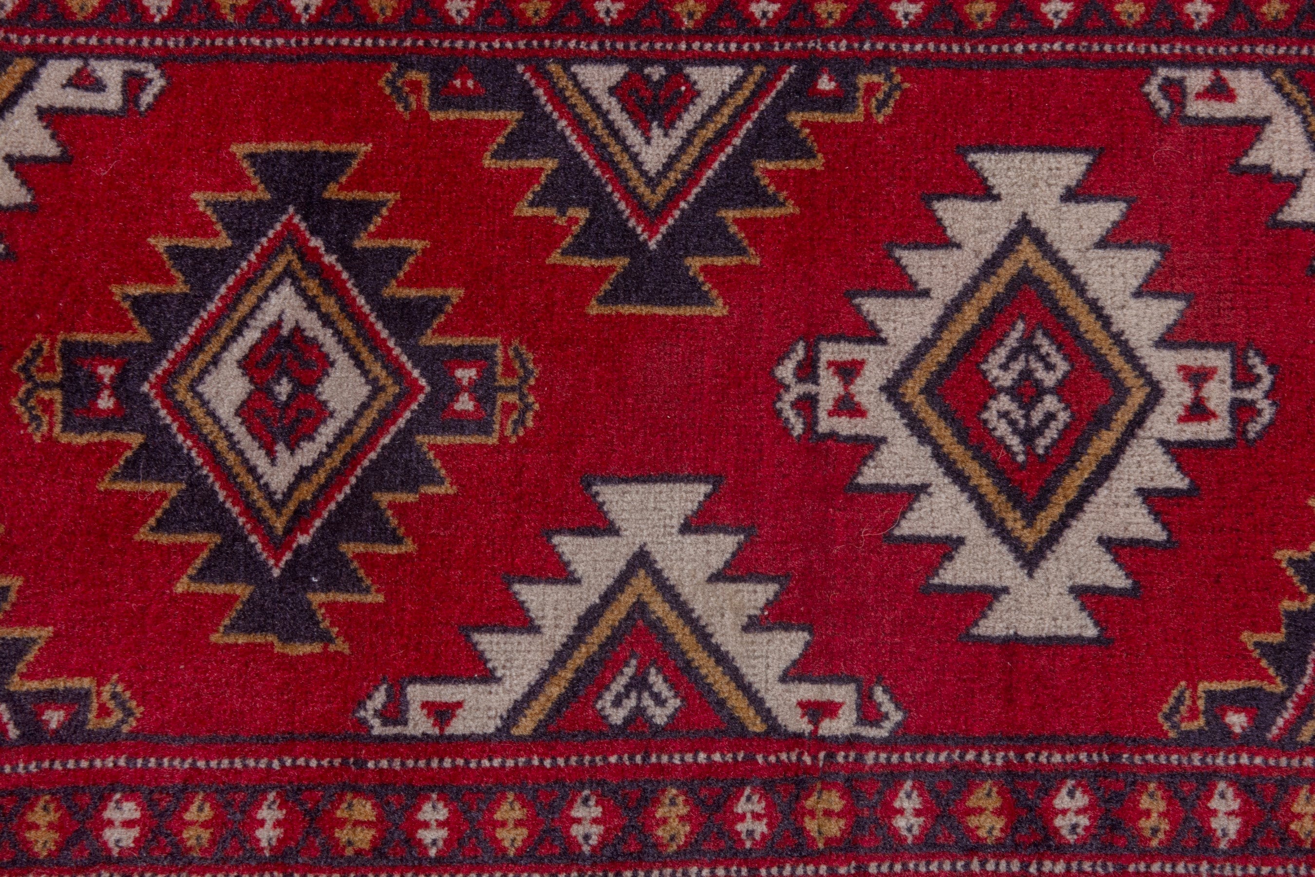 Persian Torkaman accent rug in deep red and burgundy, view 6 of 7