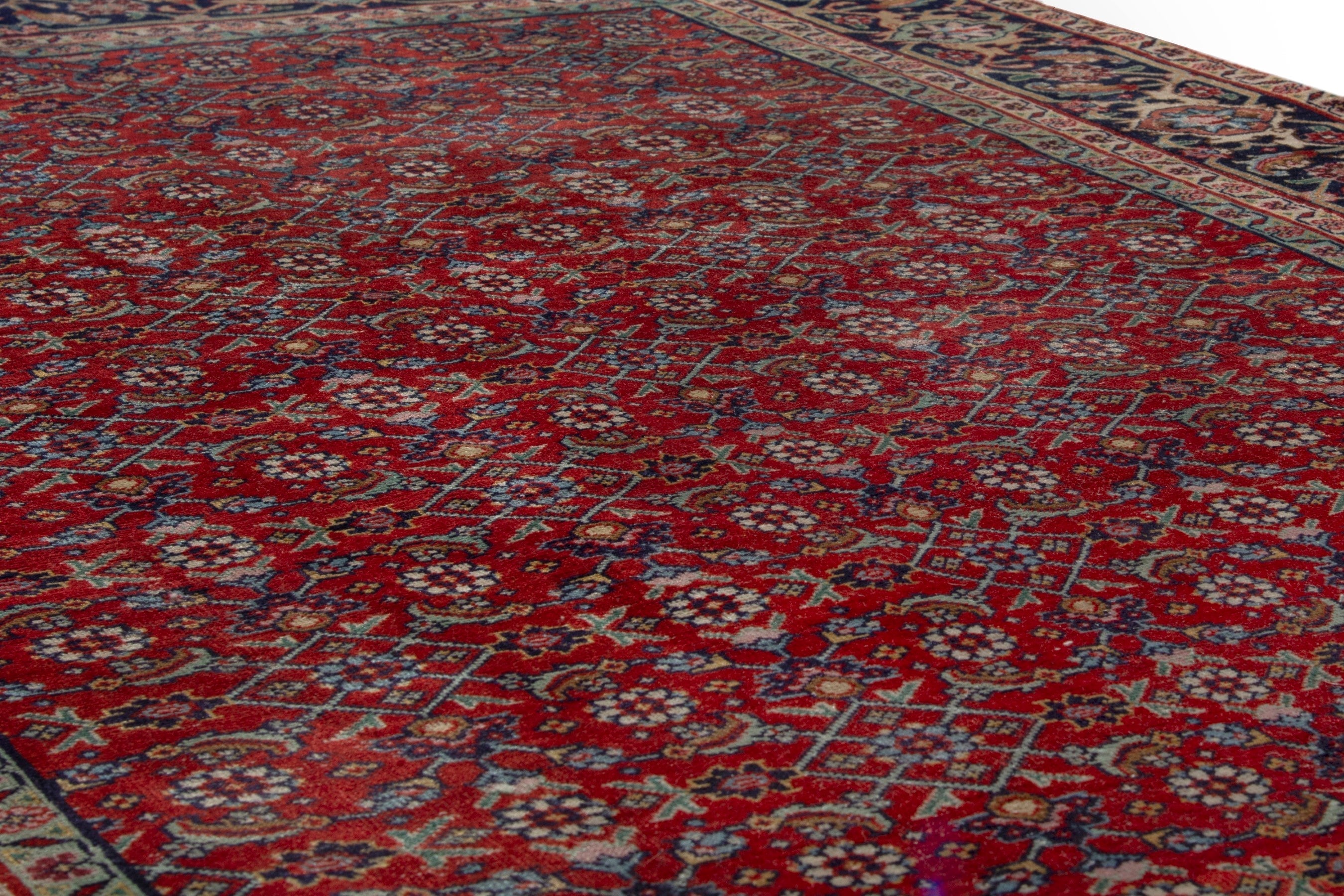 Persian Tabriz area rug in deep red and navy, view 8 of 17