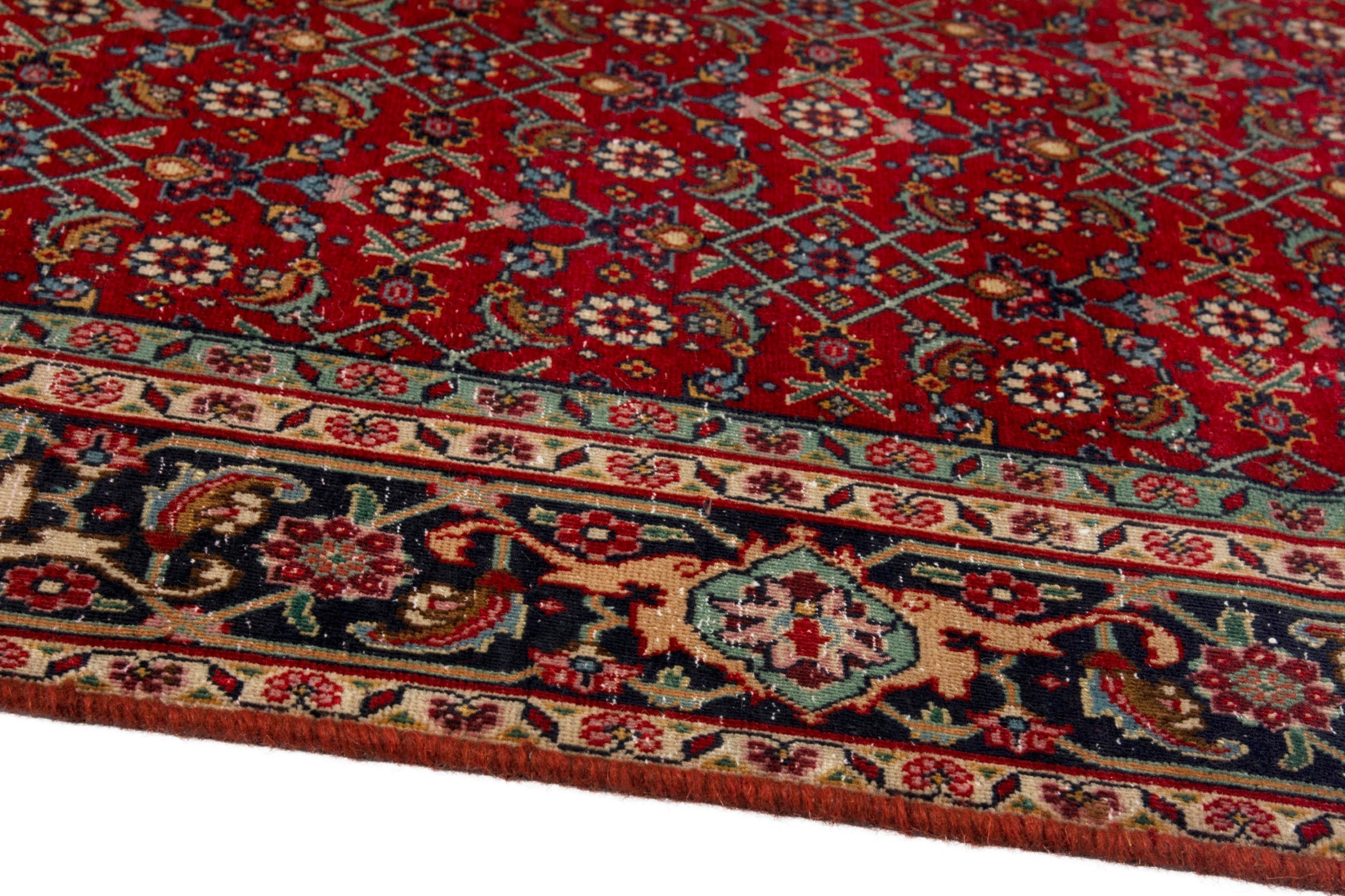 Persian Tabriz area rug in deep red and navy, view 6 of 17