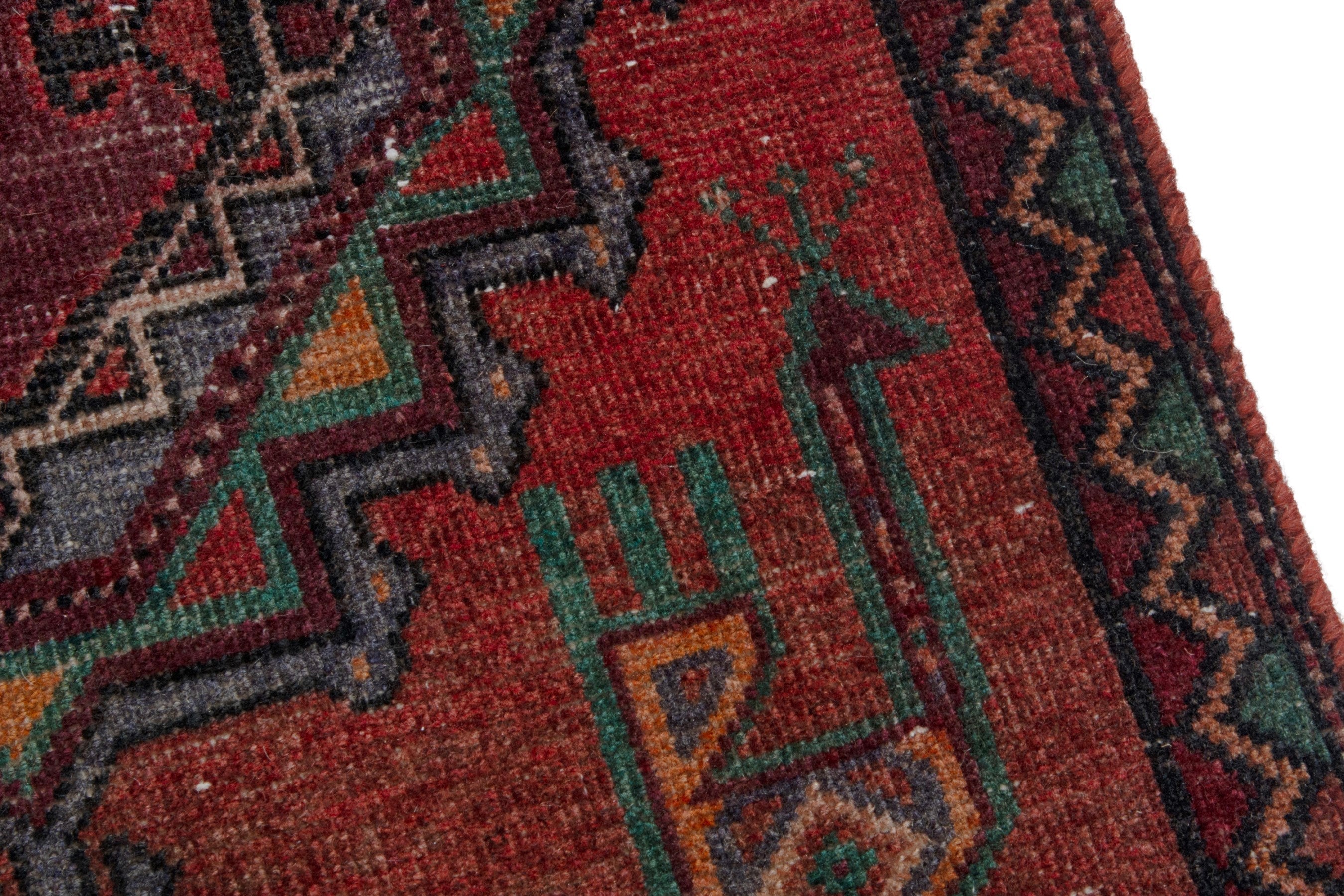 Persian Torkaman area rug in deep red and burgundy, view 9 of 18
