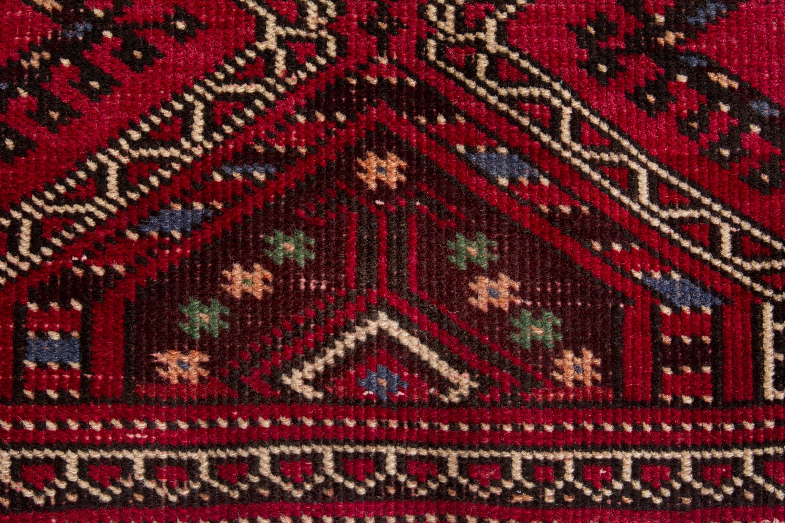 Persian Ghoochan runner rug in deep red and faded red, view 11 of 17