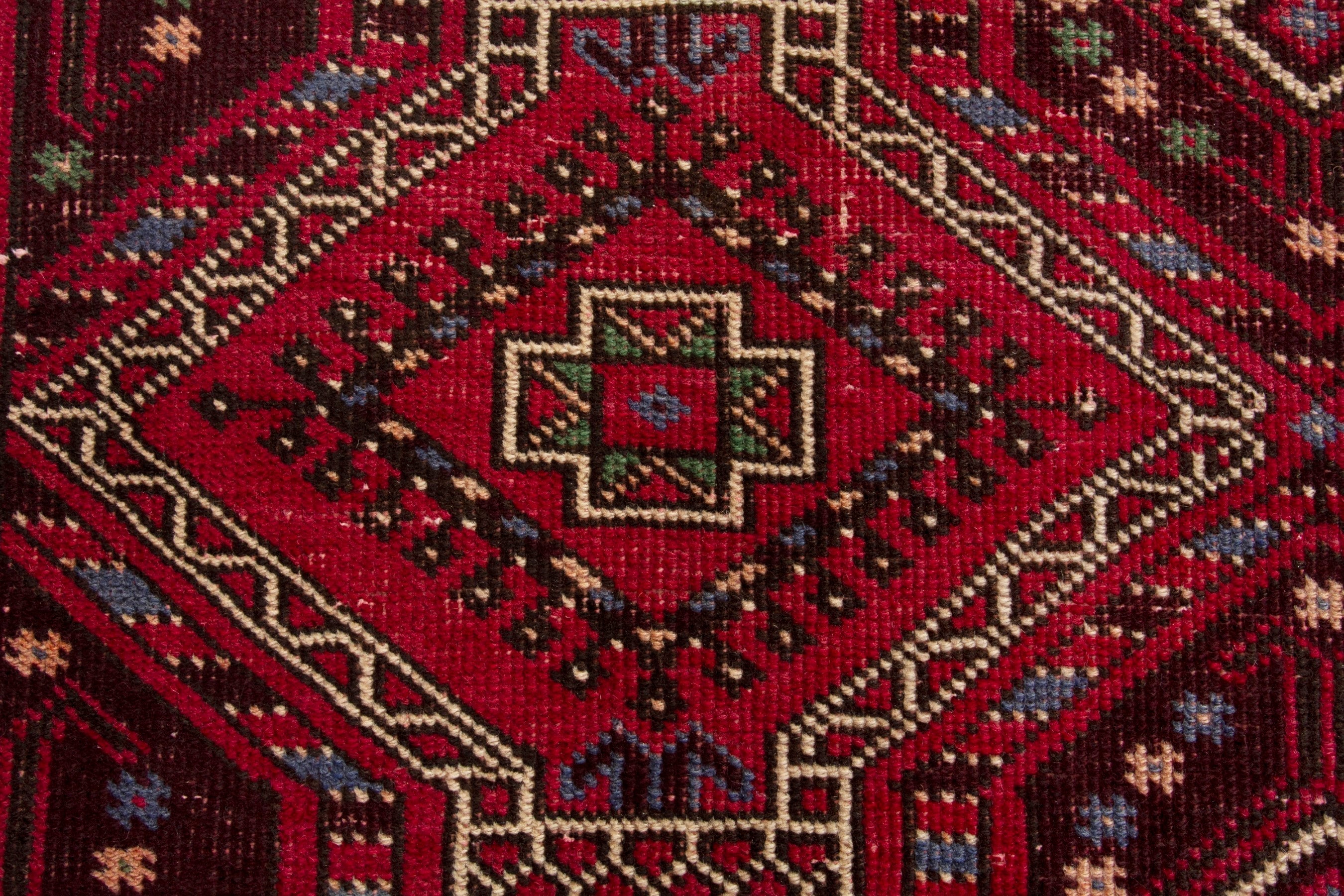 Persian Ghoochan runner rug in deep red and faded red, view 12 of 17