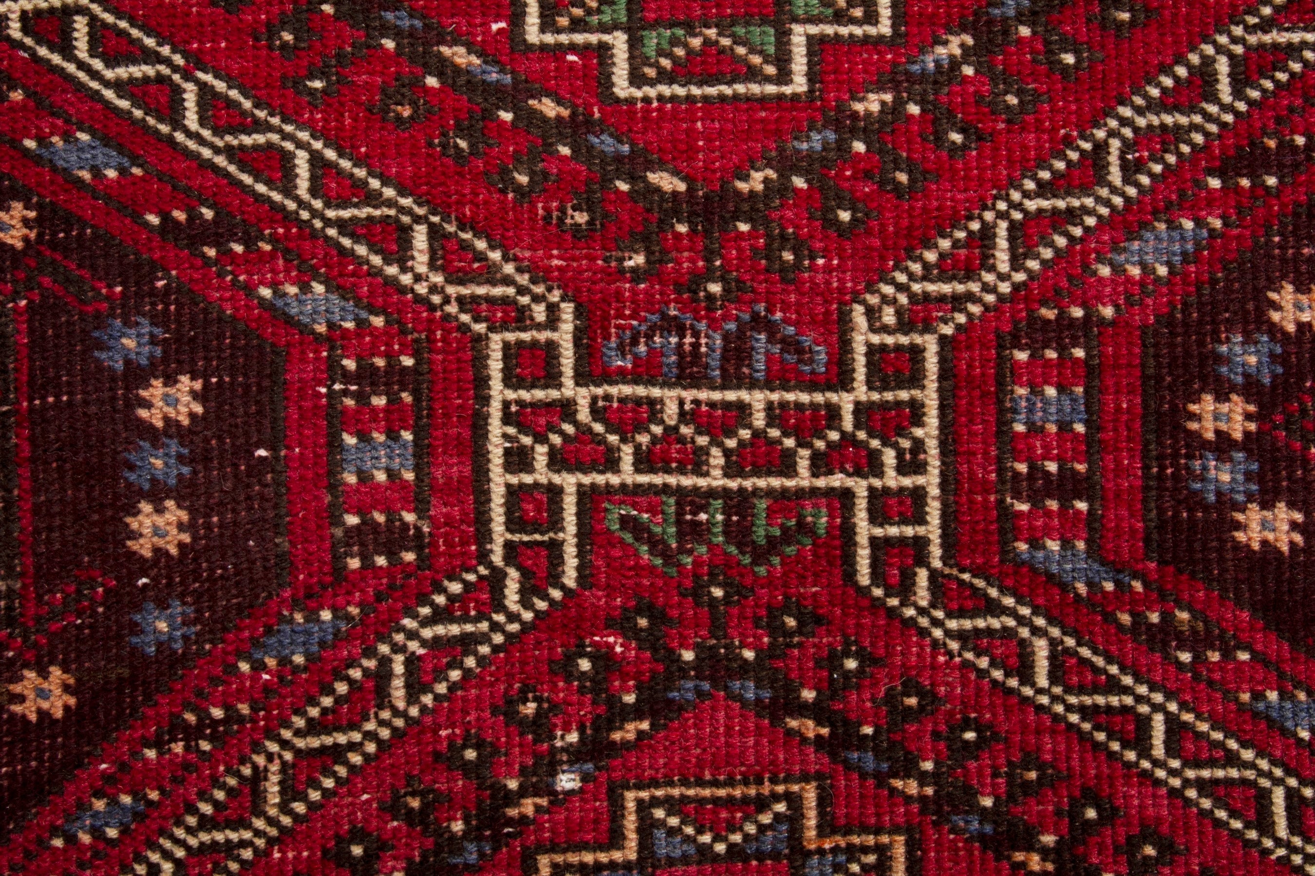 Persian Ghoochan runner rug in deep red and faded red, view 13 of 17