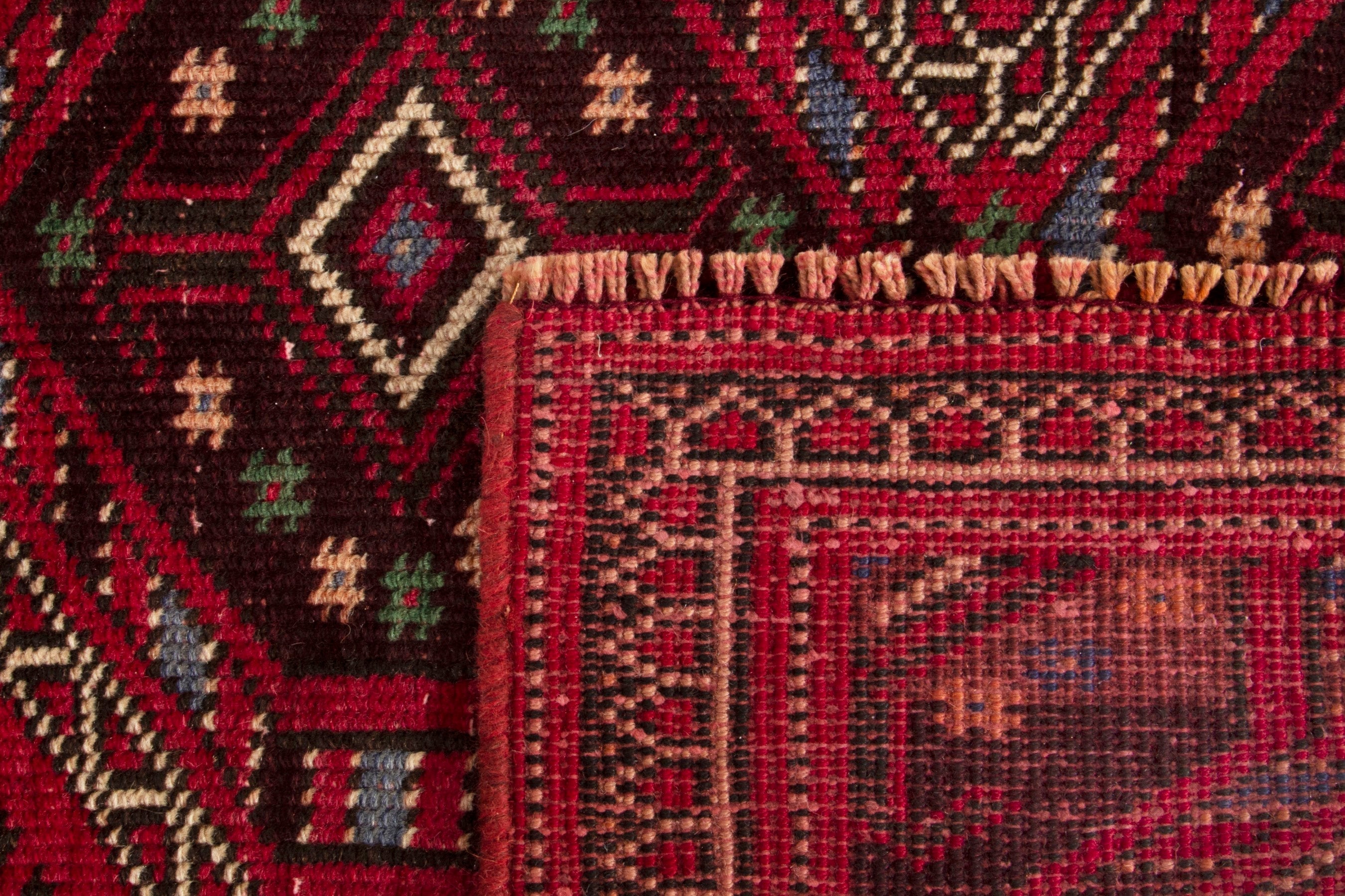 Persian Ghoochan runner rug in deep red and faded red, view 17 of 17