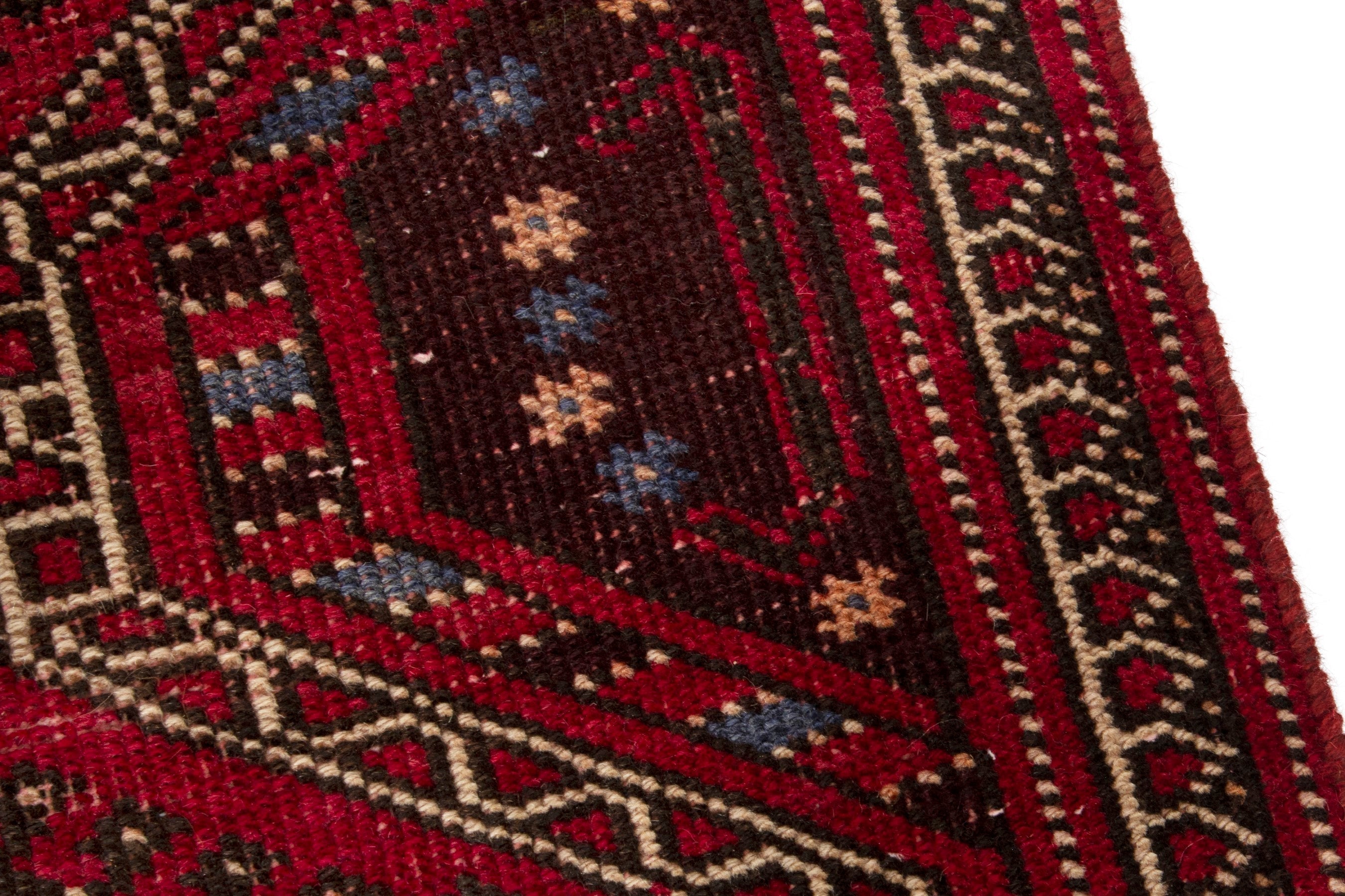 Persian Ghoochan runner rug in deep red and faded red, view 9 of 17