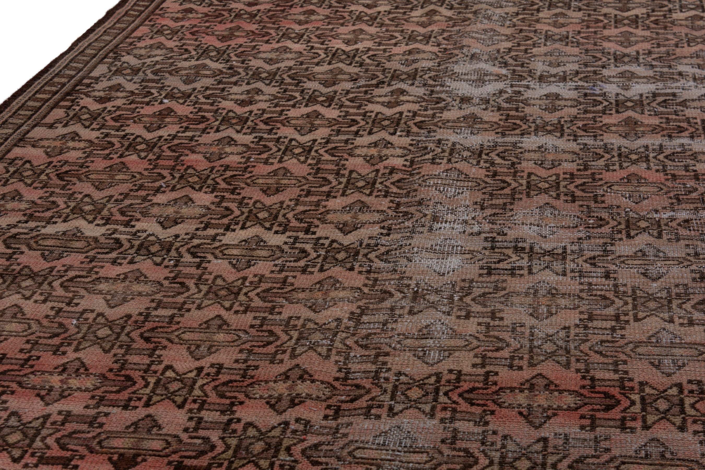 Persian Baluch runner rug in faded red and rust, view 7 of 19