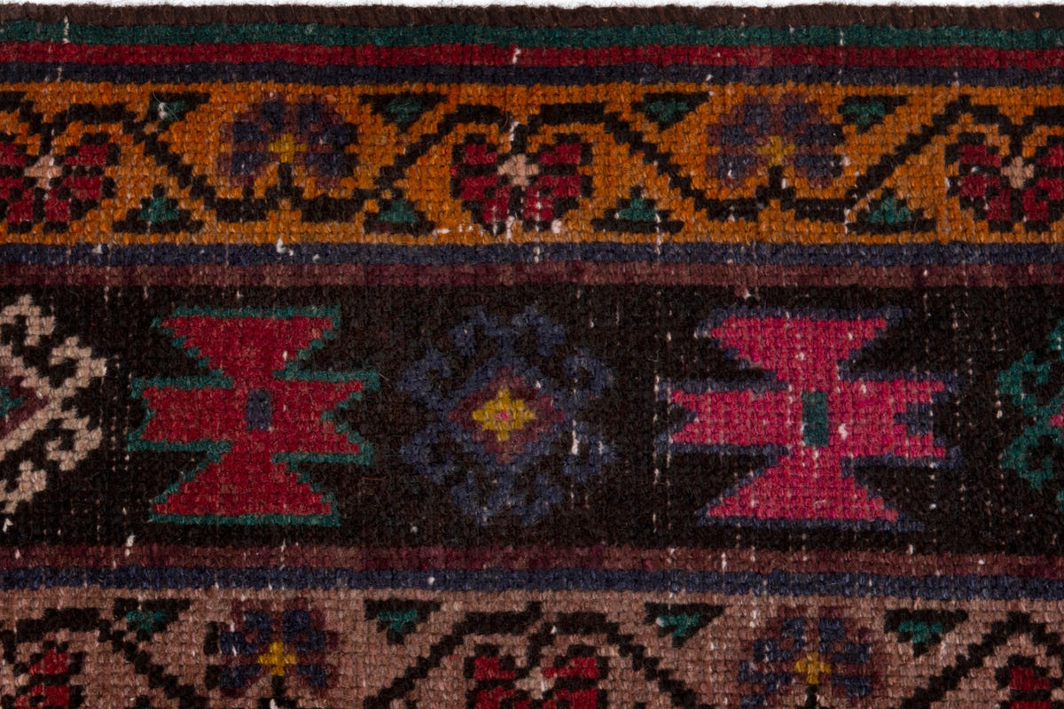 Persian Ghoochan area rug in faded red and black, view 16 of 21