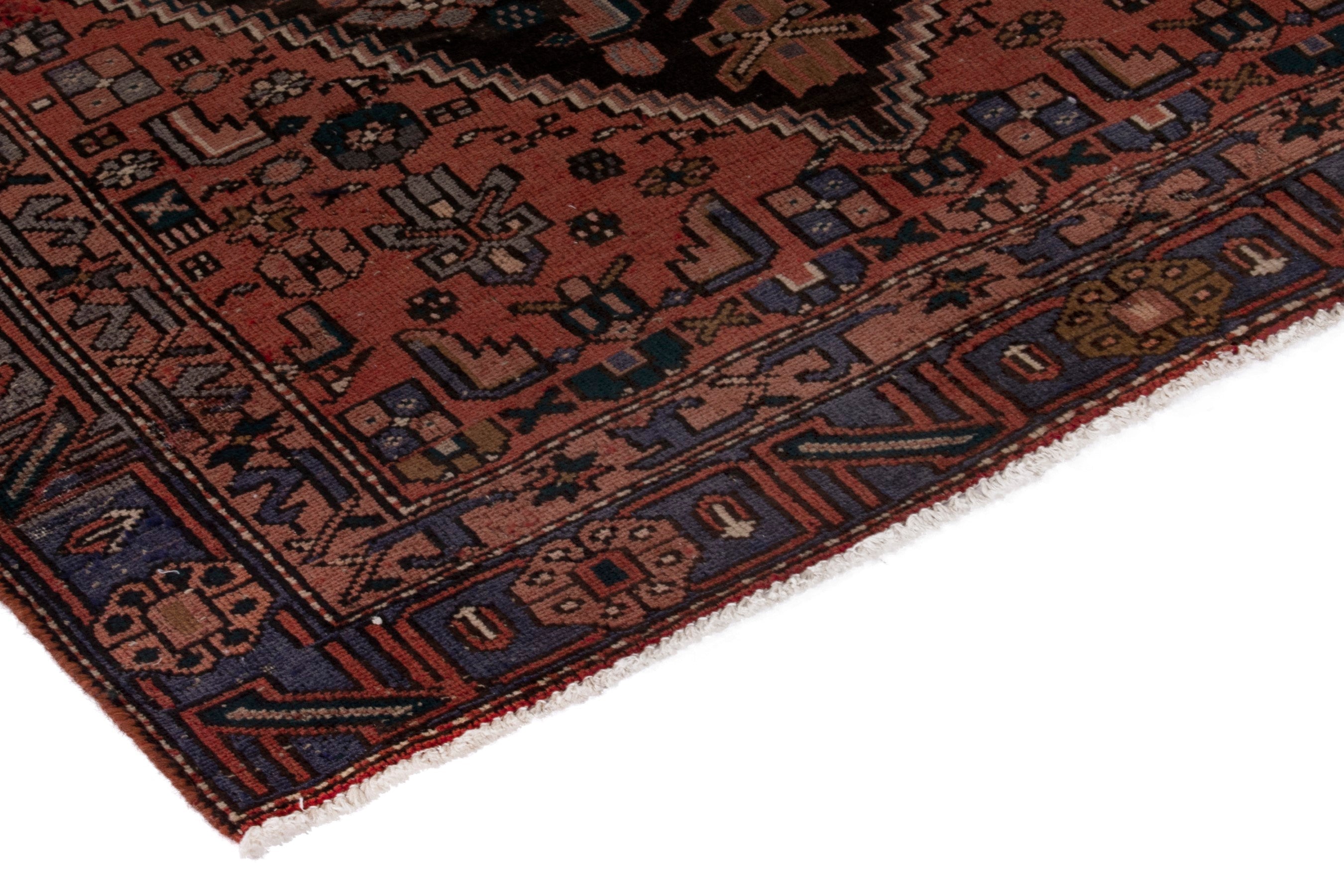 Persian Zanjan area rug in rust and dark blue, view 5 of 19