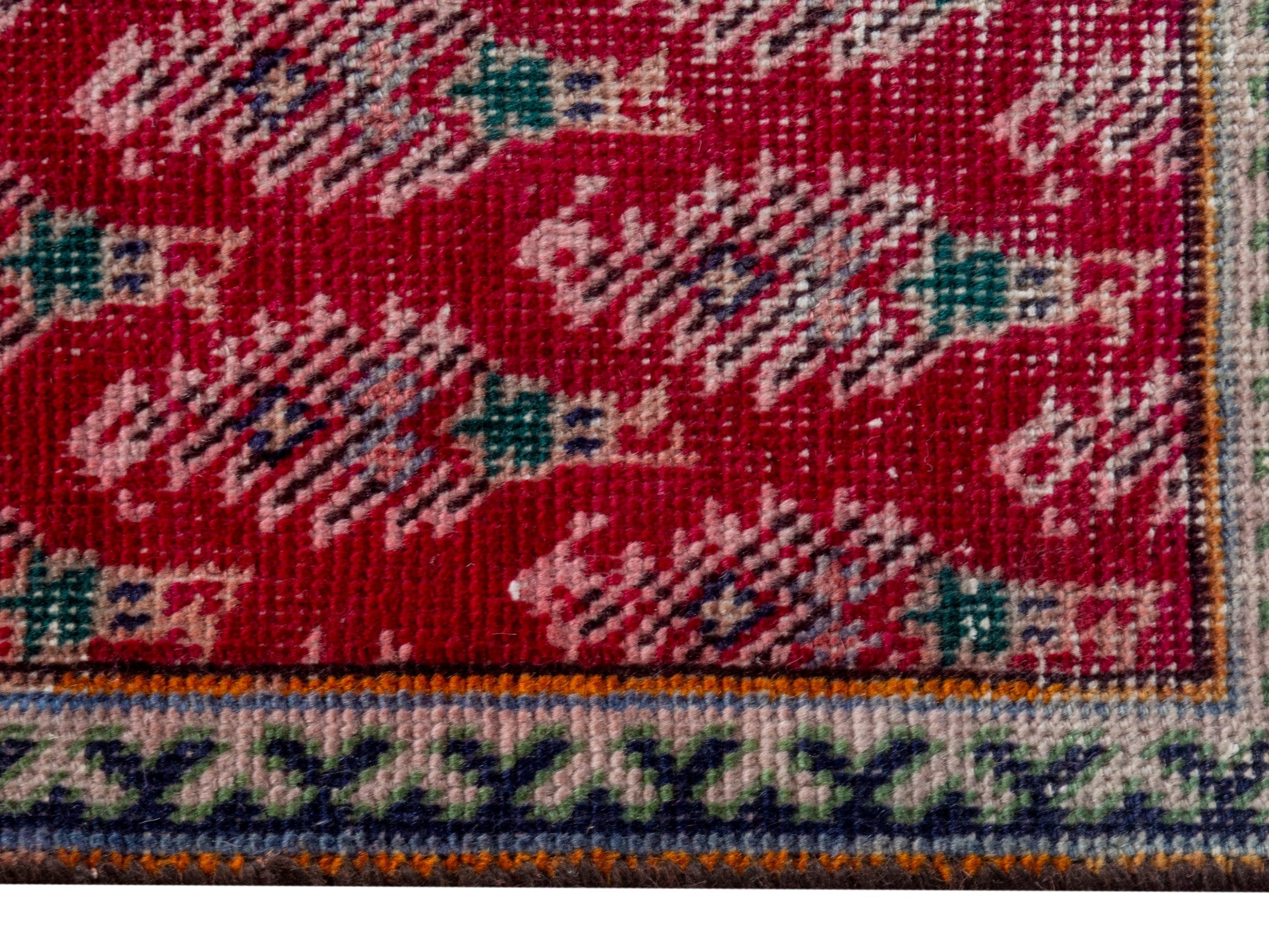 Persian Tabriz runner rug in deep red and dusty rose, view 10 of 16