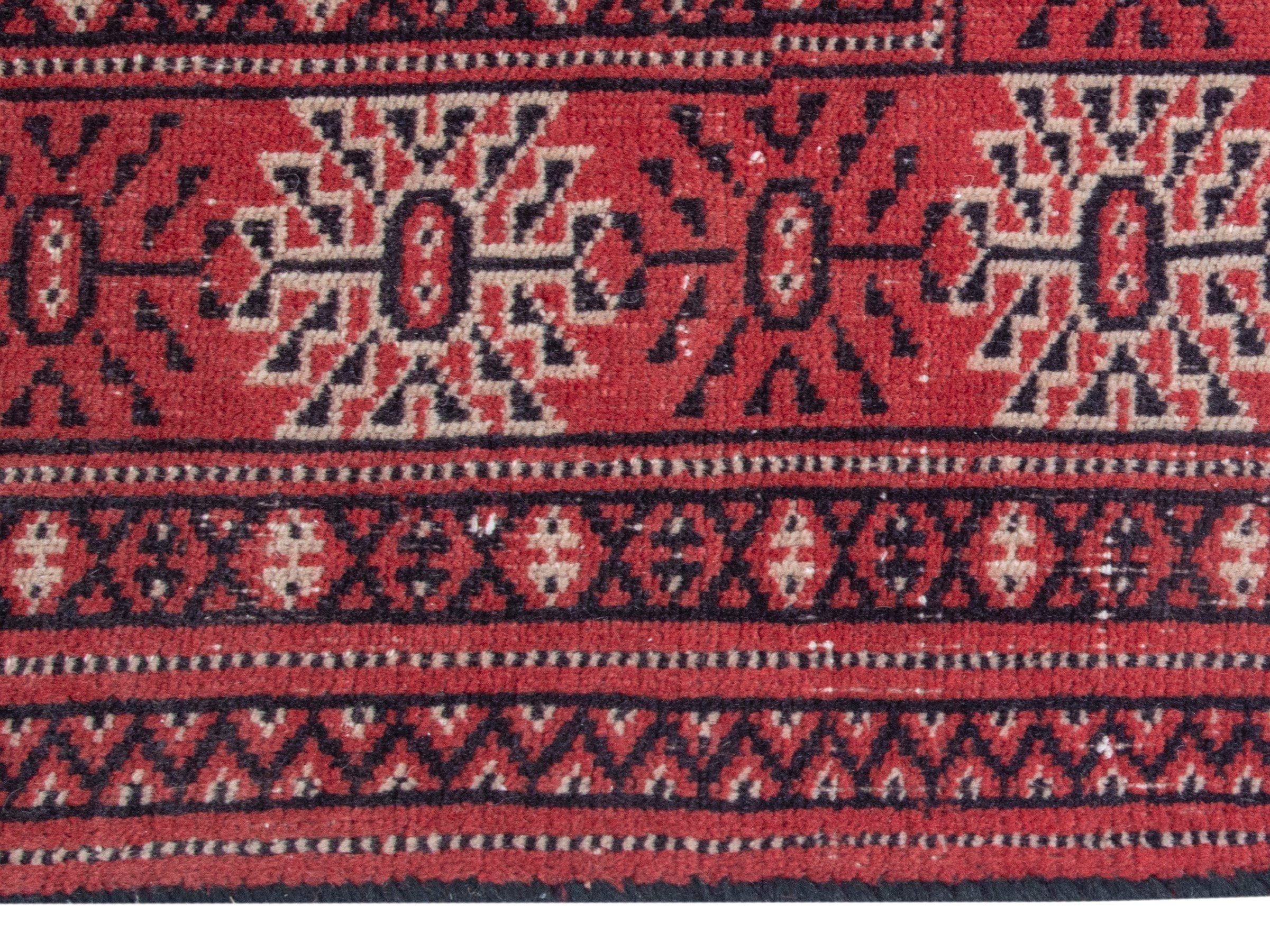 Persian Torkaman runner rug in deep red and cream, view 10 of 18
