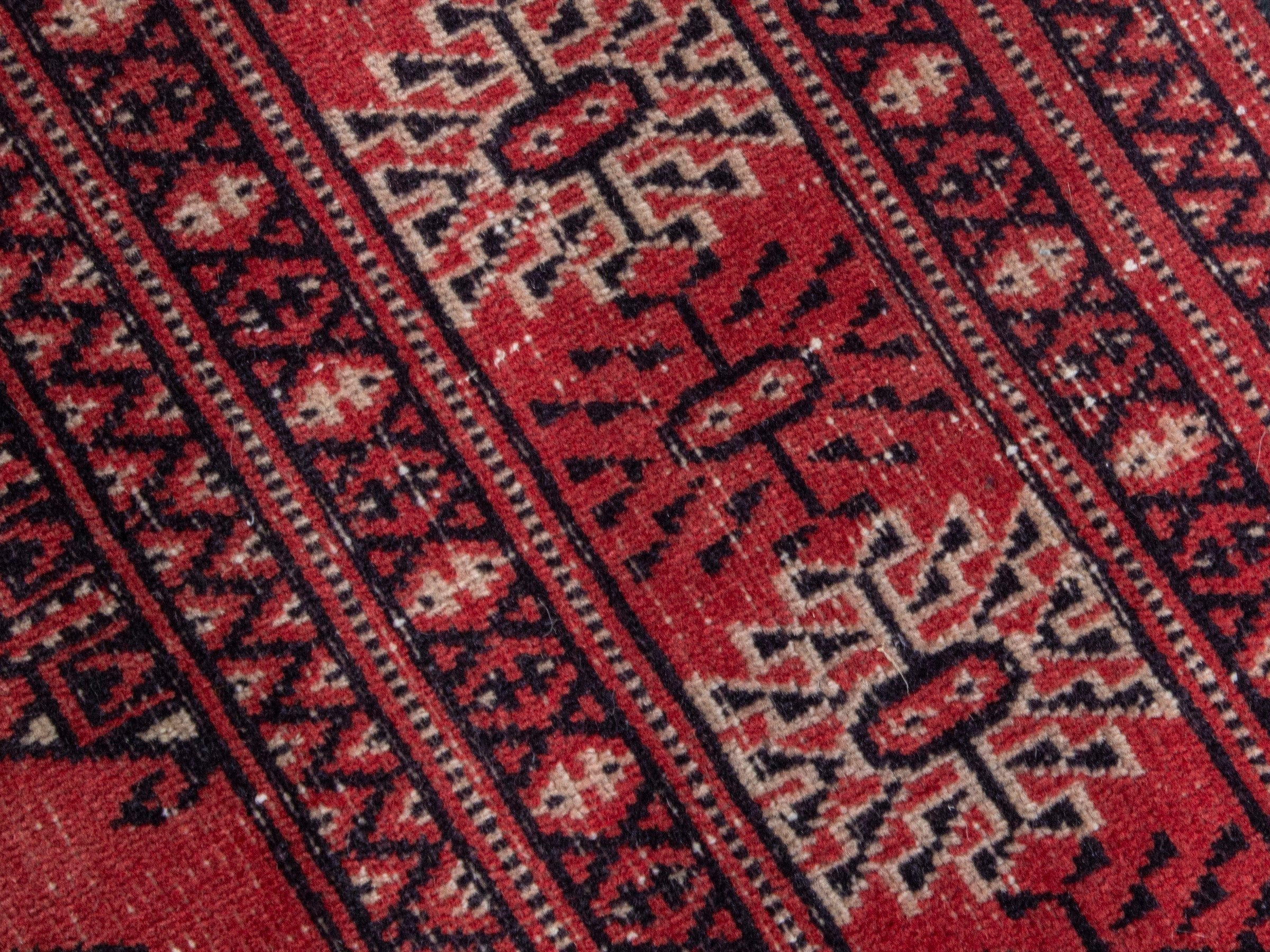 Persian Torkaman runner rug in deep red and cream, view 9 of 18