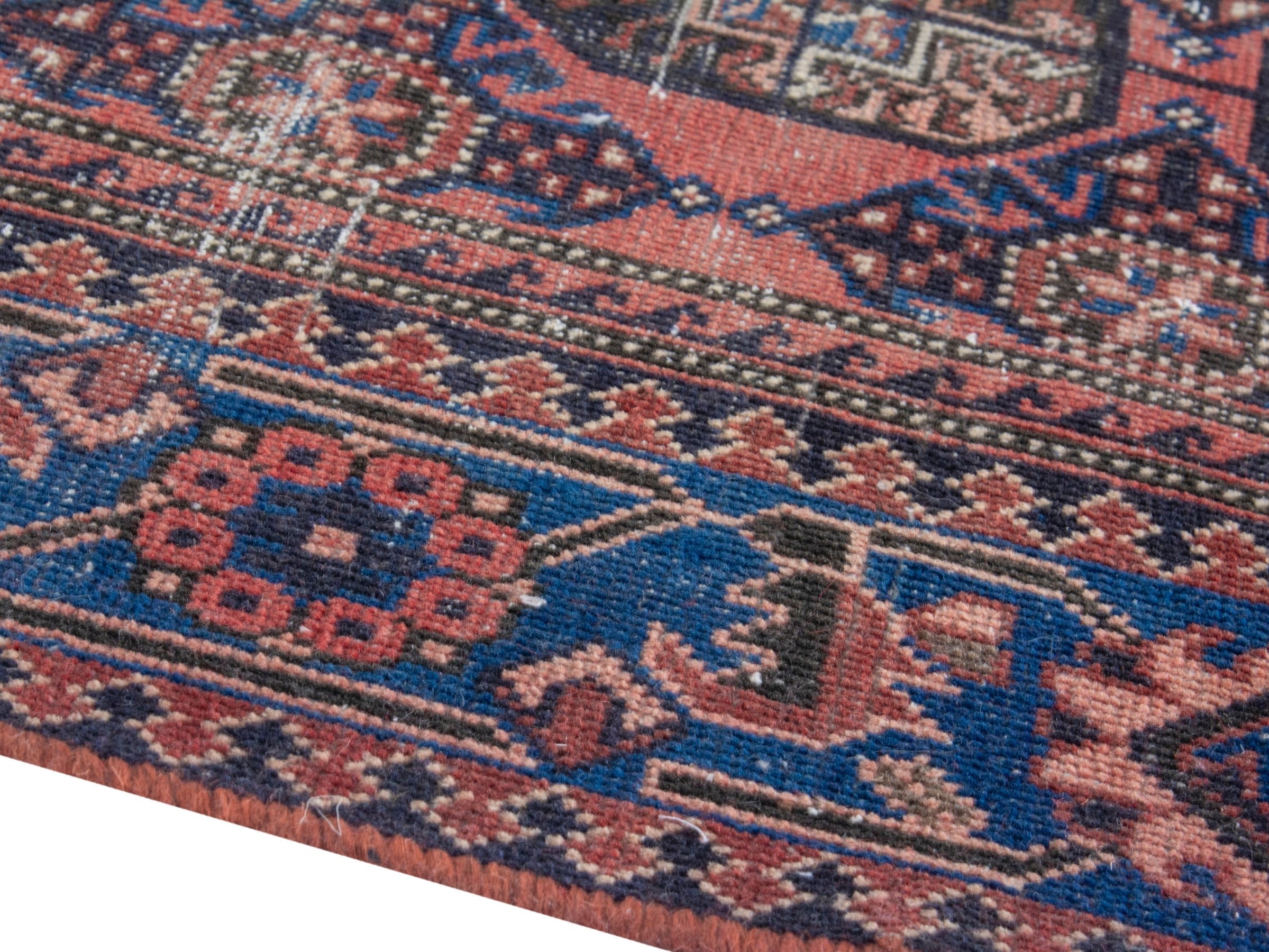 Persian Ferdos runner rug in dusty rose and dark blue, view 6 of 18