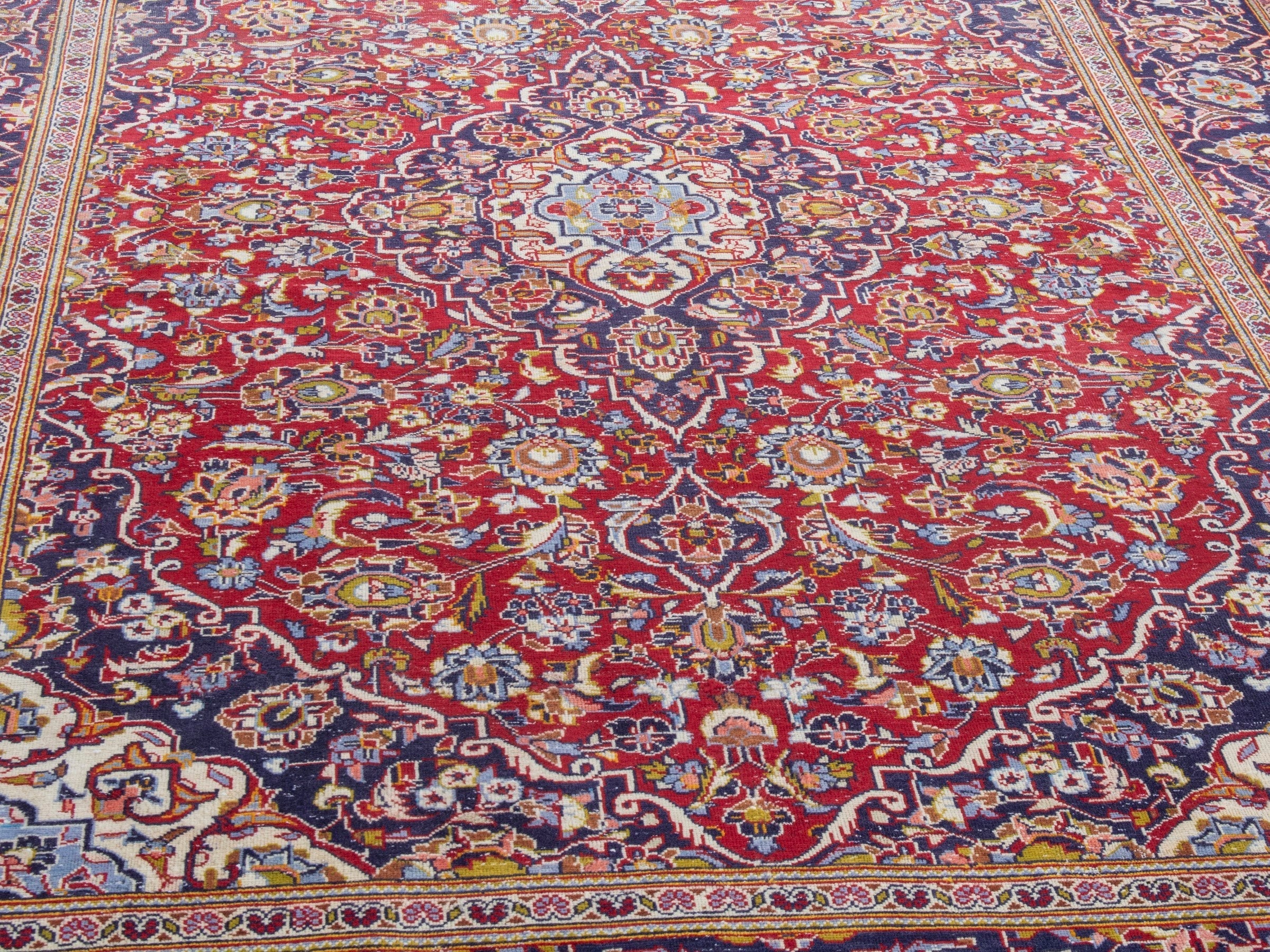 Persian Kashan area rug in deep red and dark blue, view 8 of 22