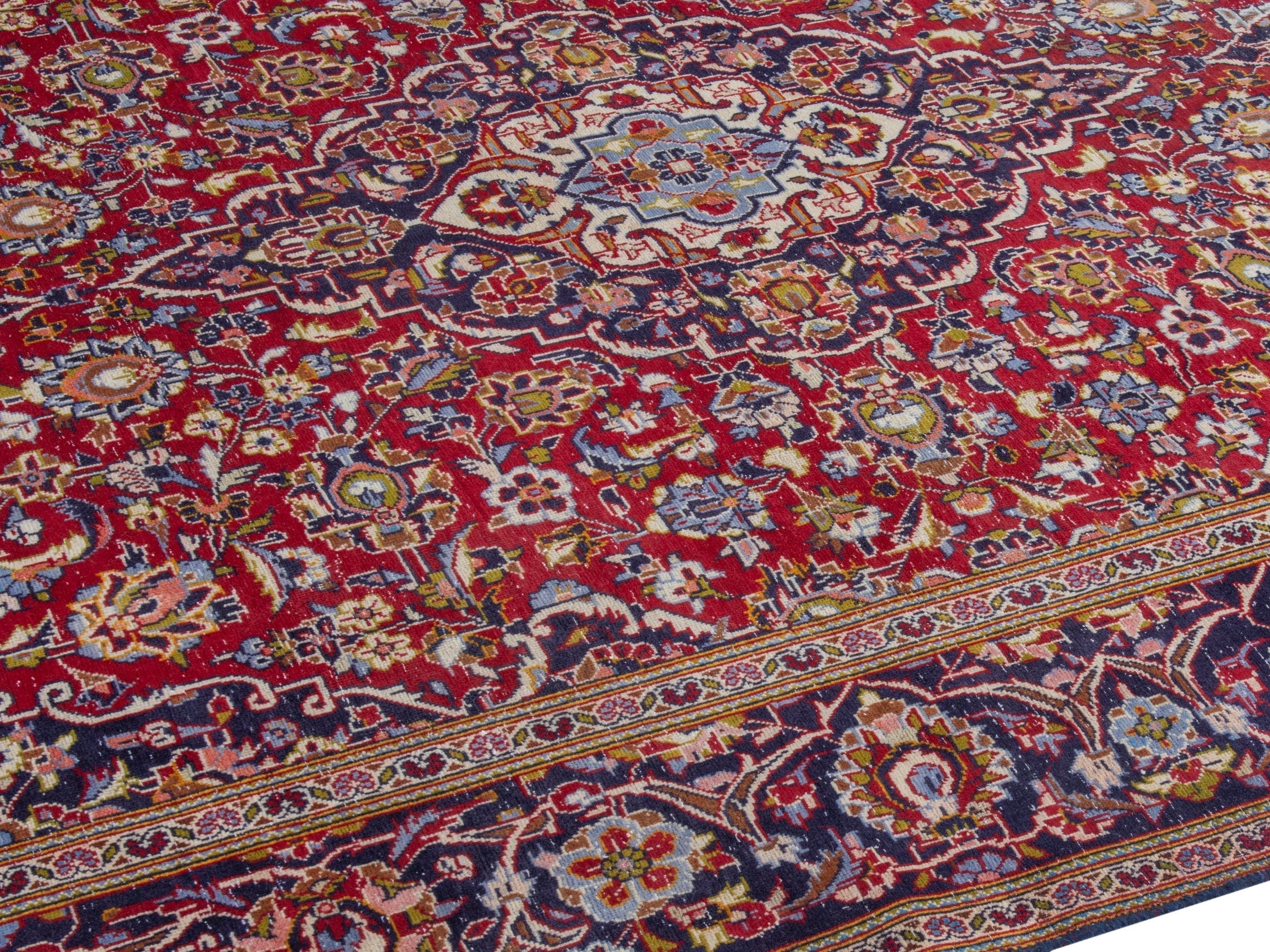 Persian Kashan area rug in deep red and dark blue, view 6 of 22